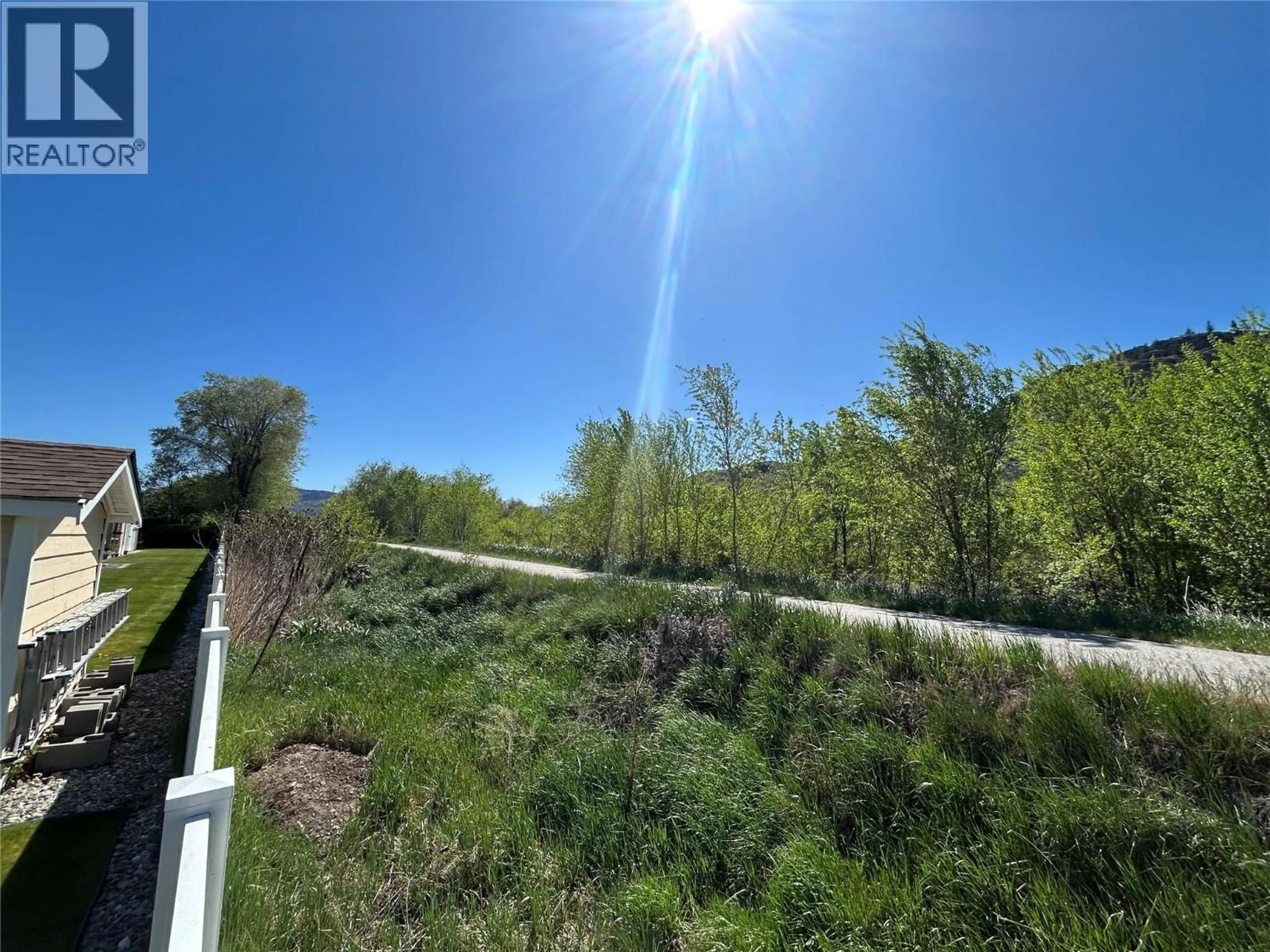 A pic from outside/outdoor area/front of a property/back of a property/a pic from drone, forest/trees view for 9 - 145 REDWING PLACE, Oliver British Columbia V0H1T4