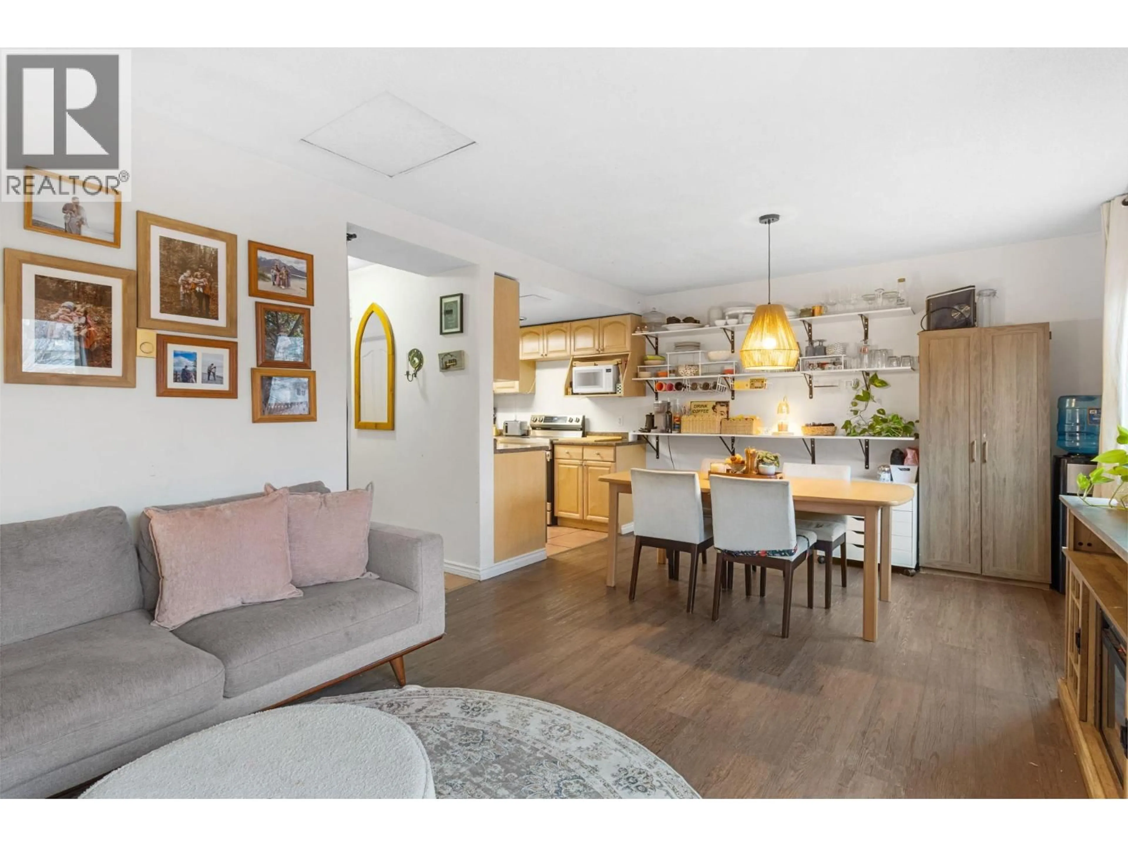 Open concept kitchen, wood/laminate floor for 6 - 1808 45 STREET, Vernon British Columbia V1T7P8