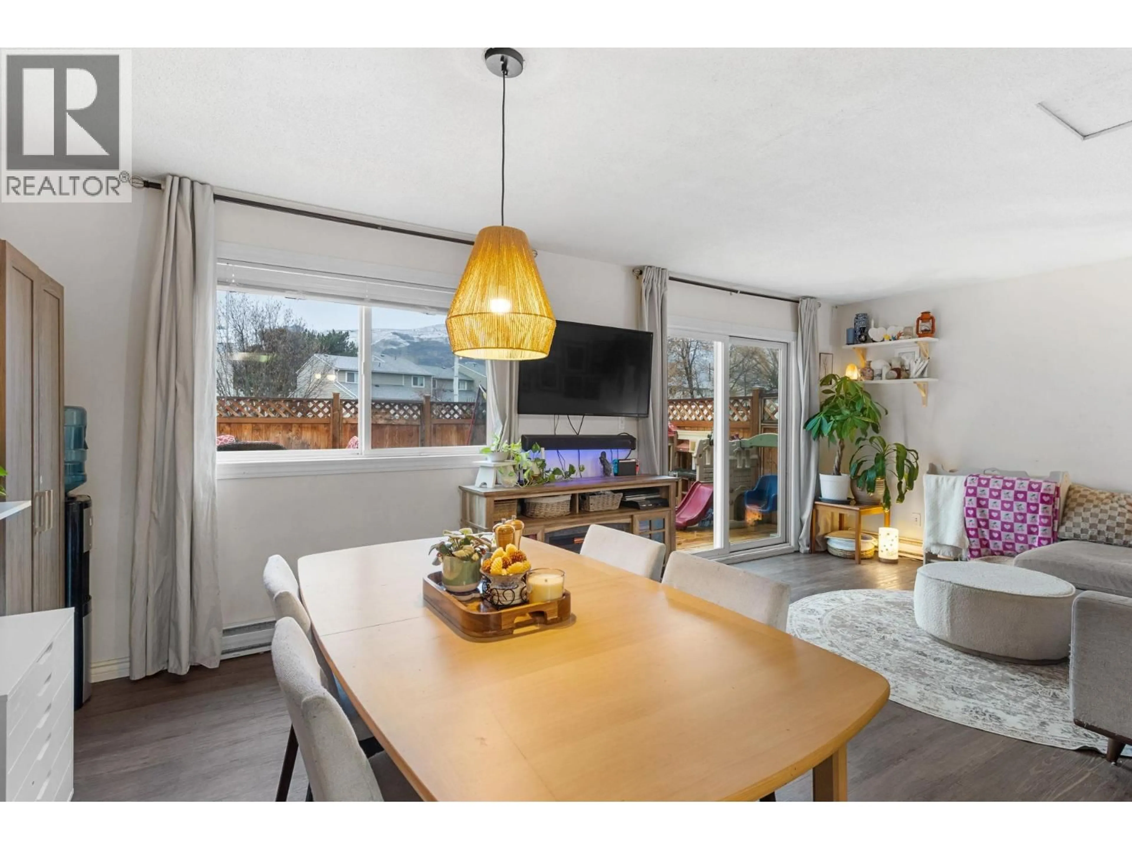 Open concept kitchen, wood/laminate floor for 6 - 1808 45 STREET, Vernon British Columbia V1T7P8