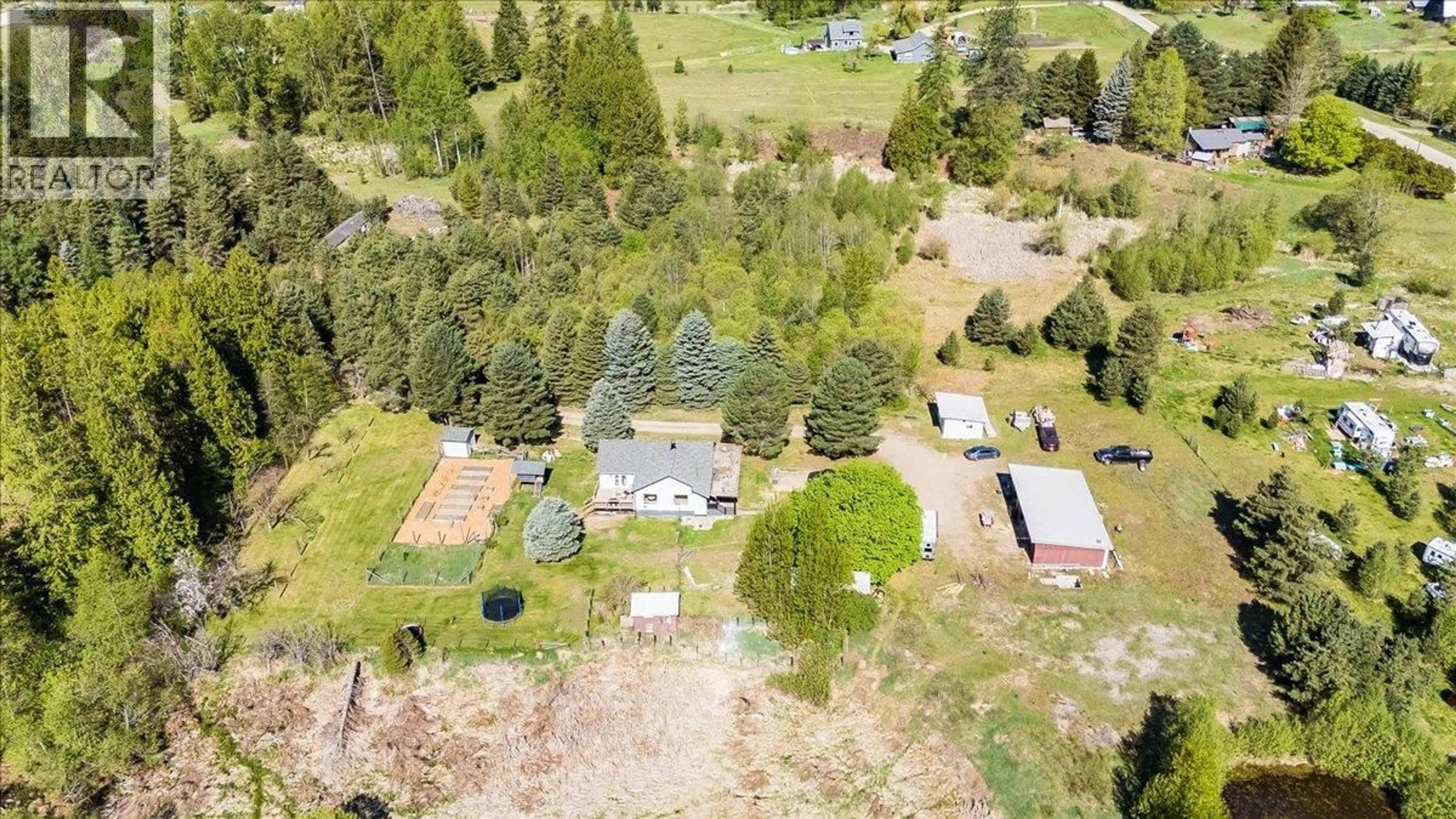A pic from outside/outdoor area/front of a property/back of a property/a pic from drone, forest/trees view for 3018 6 HIGHWAY, Slocan Park British Columbia V0G2E0