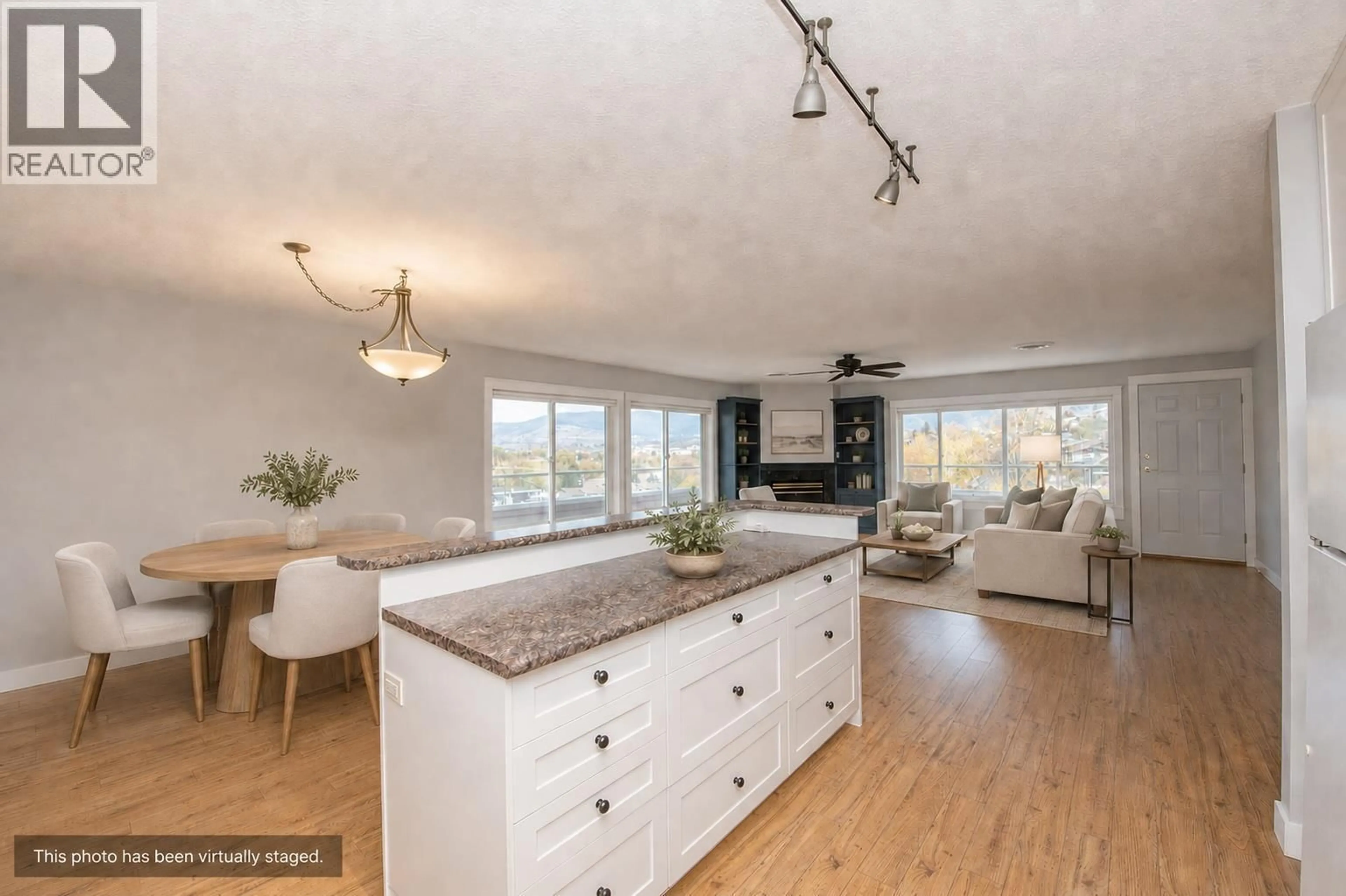 Open concept kitchen, wood/laminate floor for 309 - 3929 22 AVENUE, Vernon British Columbia V1T7M7