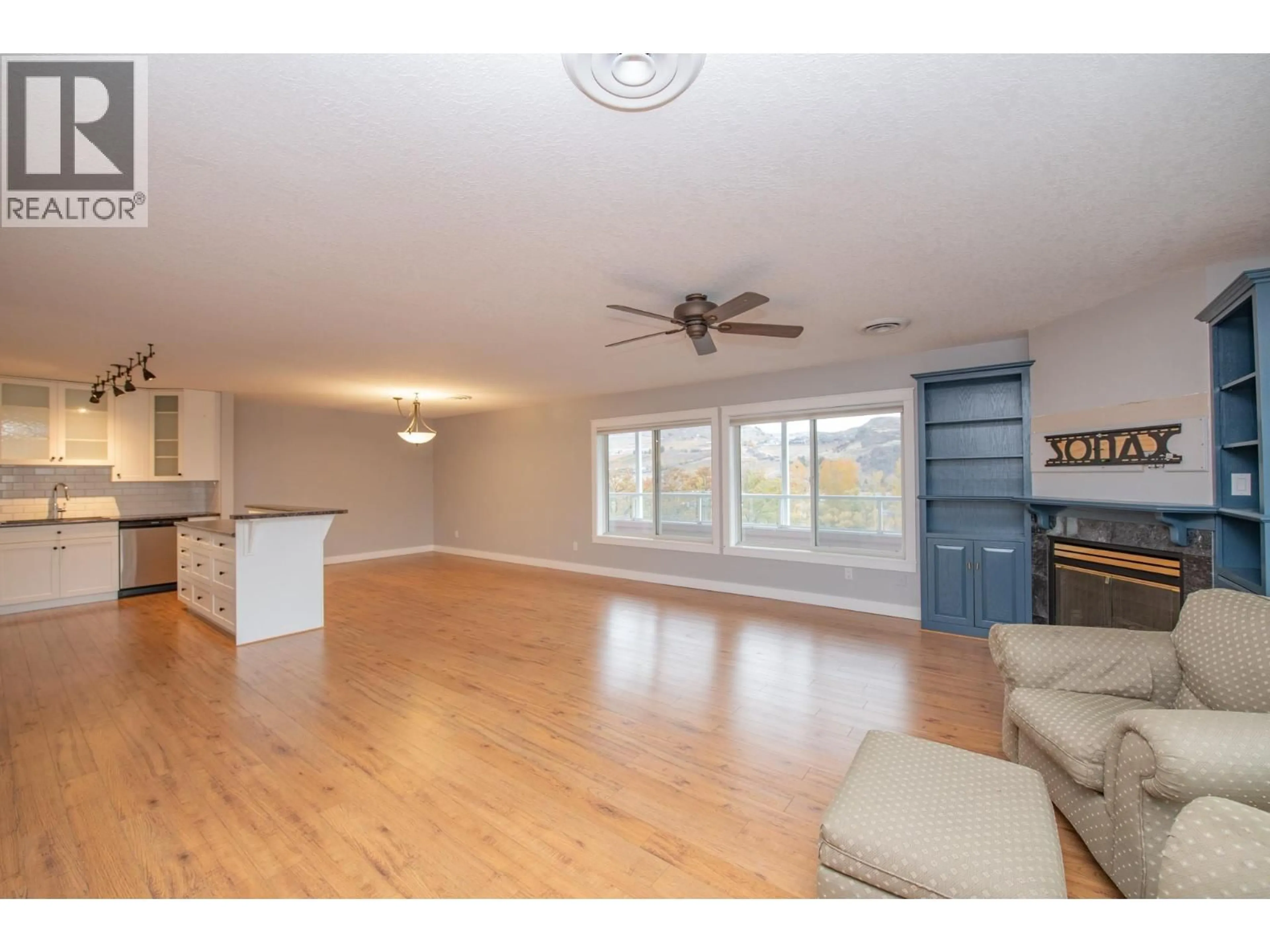 Open concept kitchen, wood/laminate floor for 309 - 3929 22 AVENUE, Vernon British Columbia V1T7M7