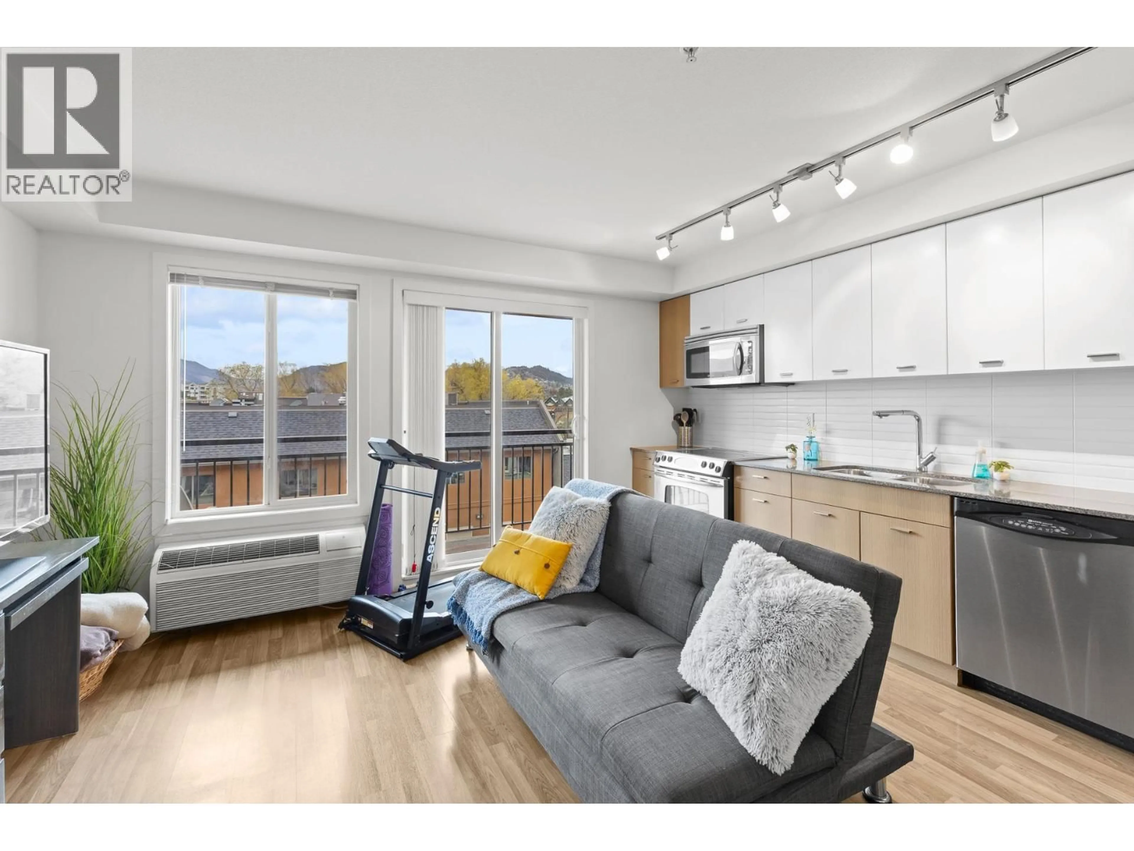 Open concept kitchen, wood/laminate floor for 316 - 1550 DICKSON AVENUE, Kelowna British Columbia V1Y4B7
