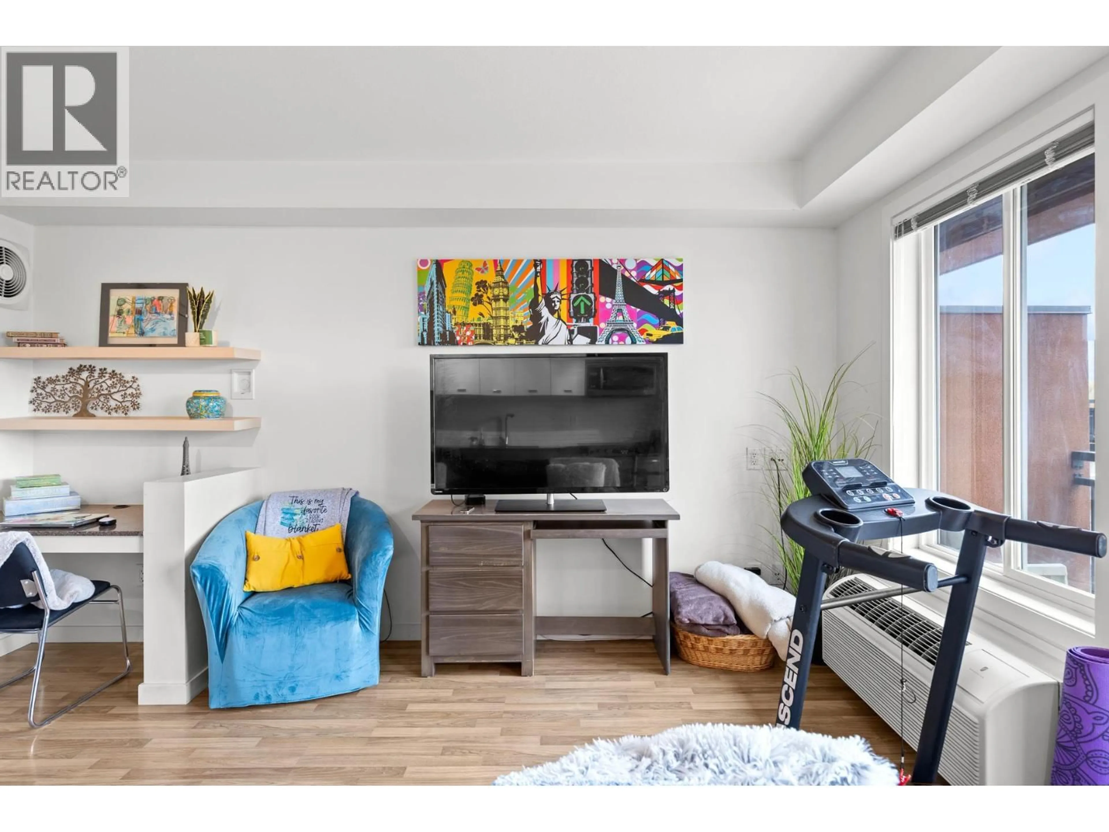 Living room with furniture, wood/laminate floor for 316 - 1550 DICKSON AVENUE, Kelowna British Columbia V1Y4B7
