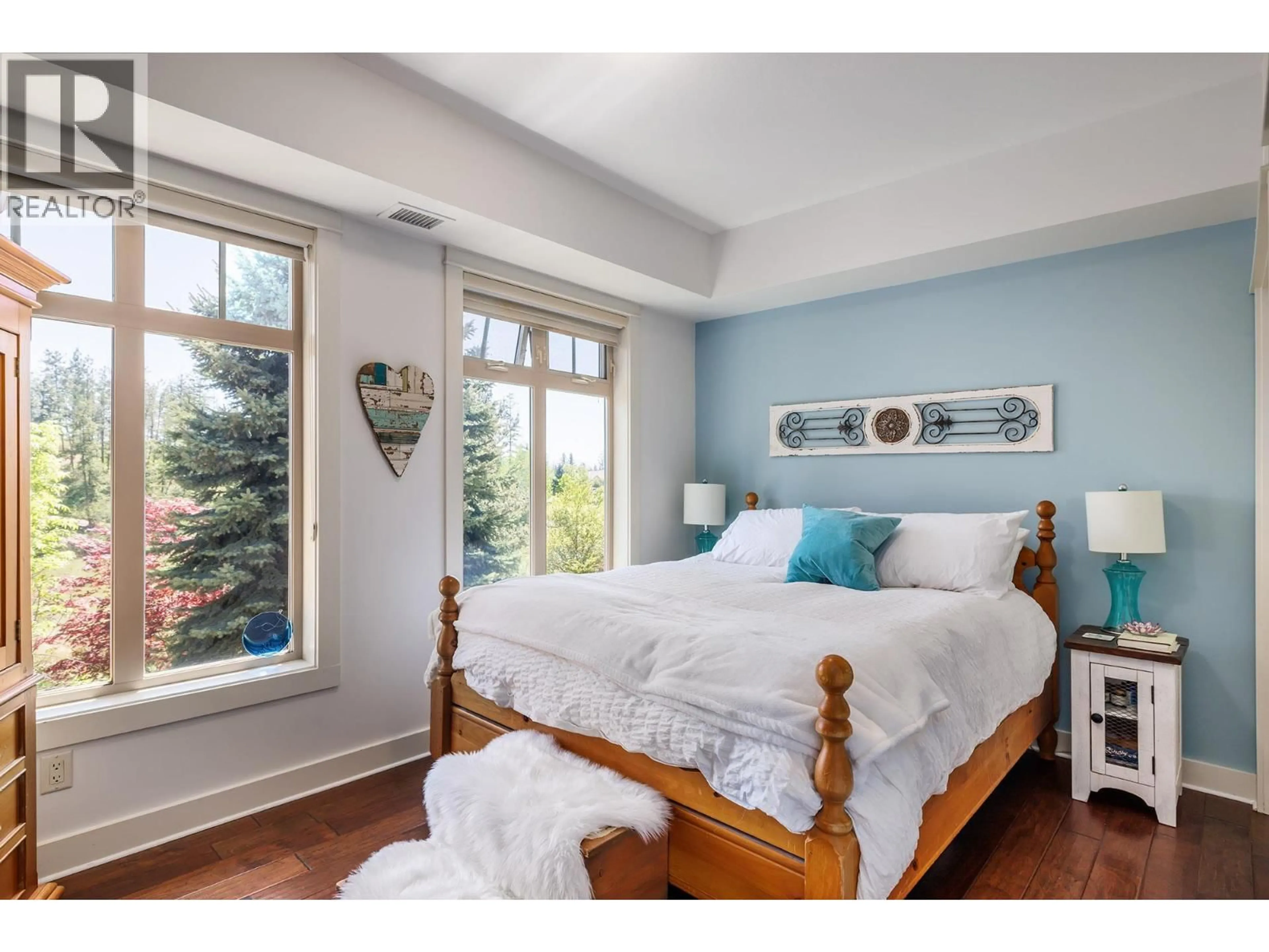Bedroom with bed, wood/laminate floor for 205 - 2611 STILLWATER WAY, Lake Country British Columbia V4V2R3