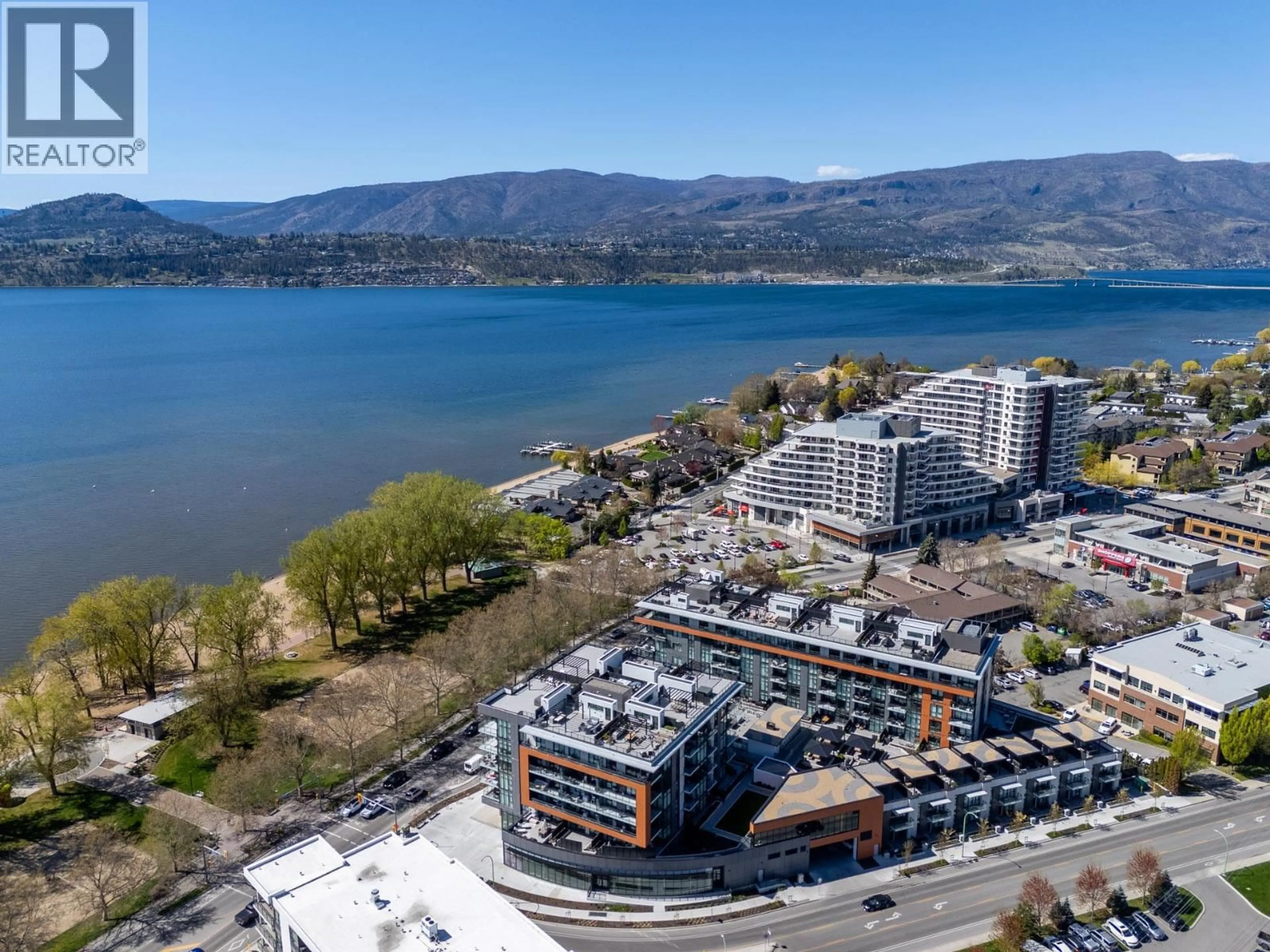A pic from outside/outdoor area/front of a property/back of a property/a pic from drone, water/lake/river/ocean view for 407 - 3409 LAKESHORE ROAD, Kelowna British Columbia V1W0G6