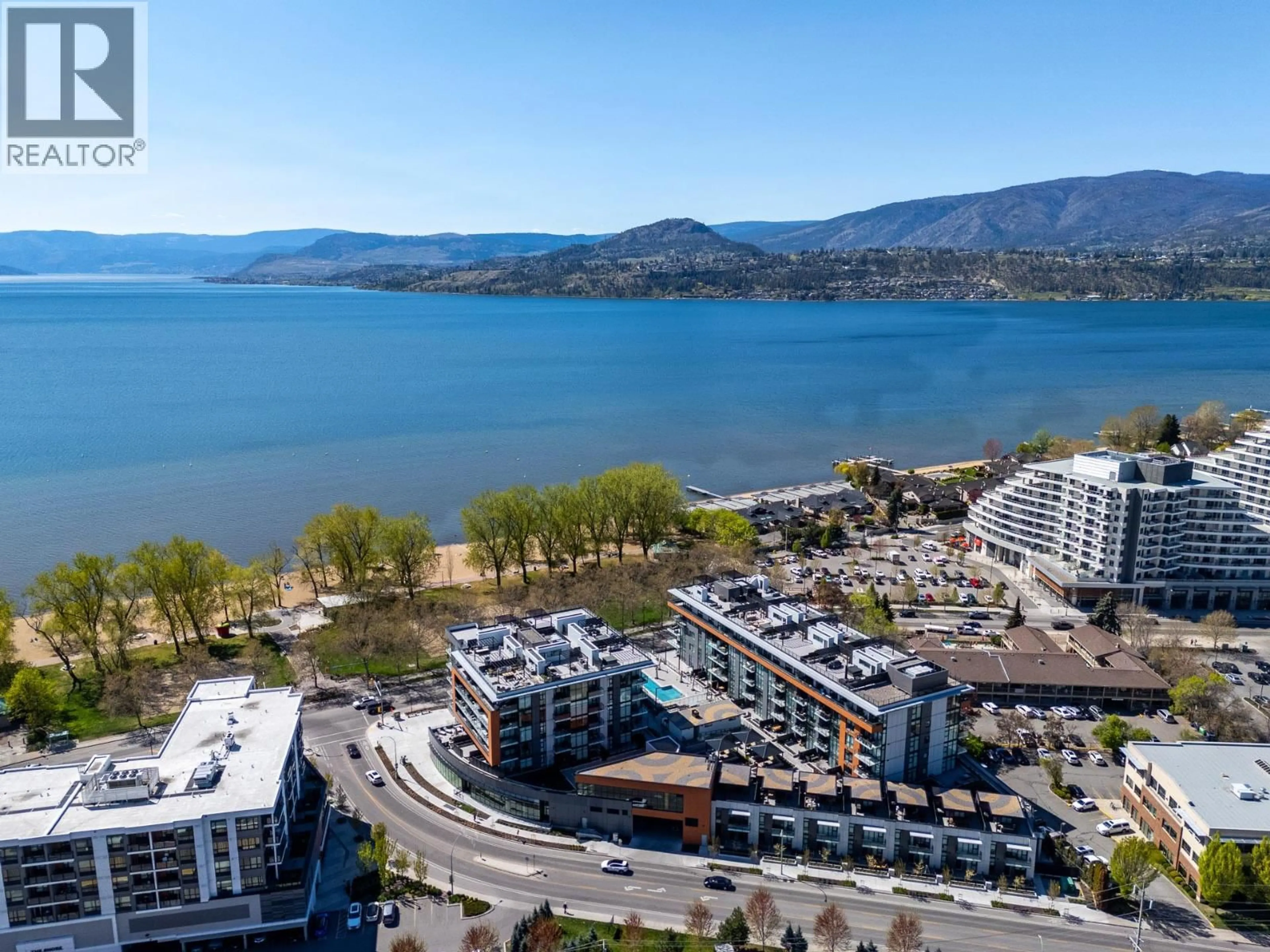 A pic from outside/outdoor area/front of a property/back of a property/a pic from drone, water/lake/river/ocean view for 407 - 3409 LAKESHORE ROAD, Kelowna British Columbia V1W0G6
