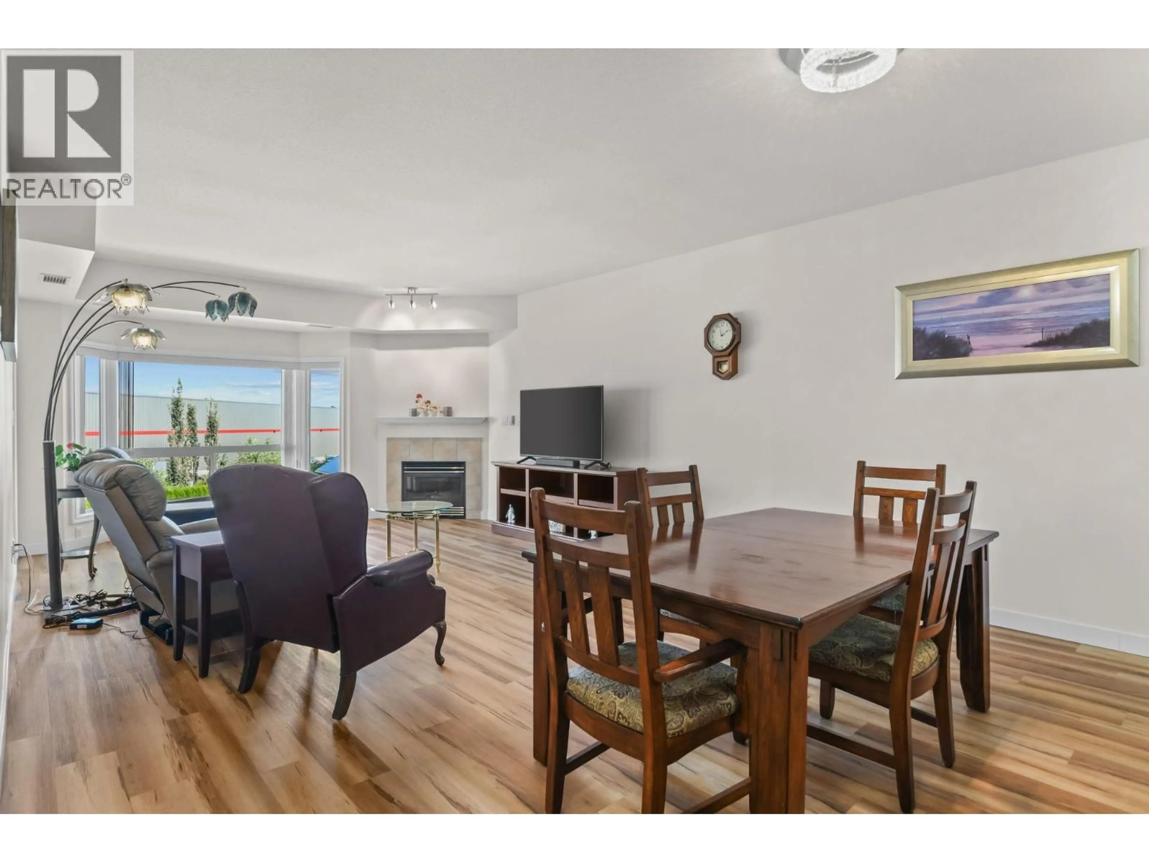 Dining room, wood/laminate floor for 303 - 1963 DURNIN ROAD, Kelowna British Columbia V1X7Y4