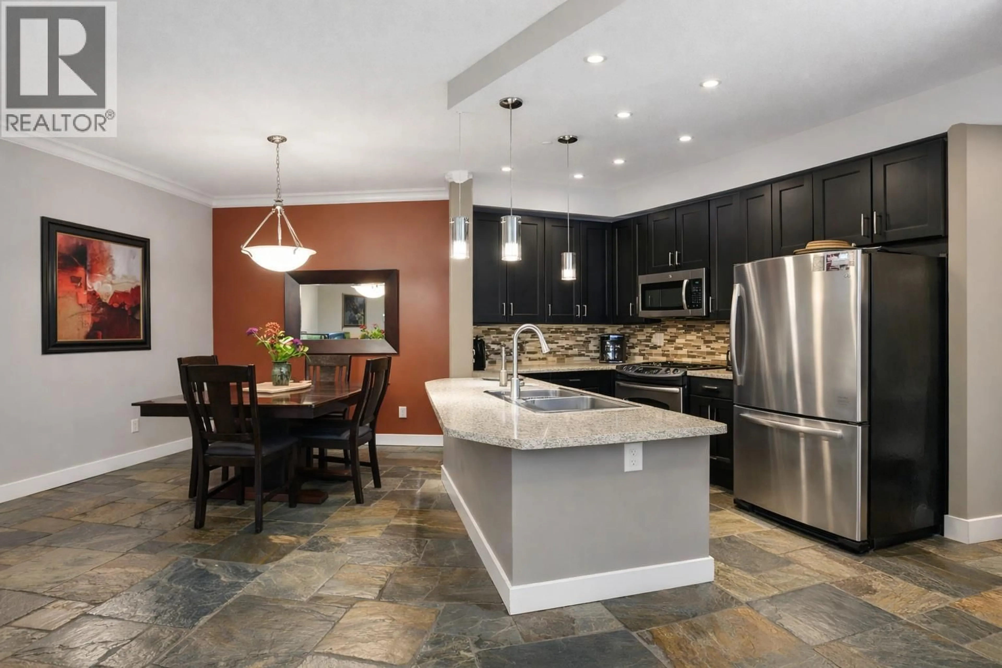 Open concept kitchen, ceramic/tile floor for 103 - 2300 BENVOULIN ROAD, Kelowna British Columbia V1W2C6