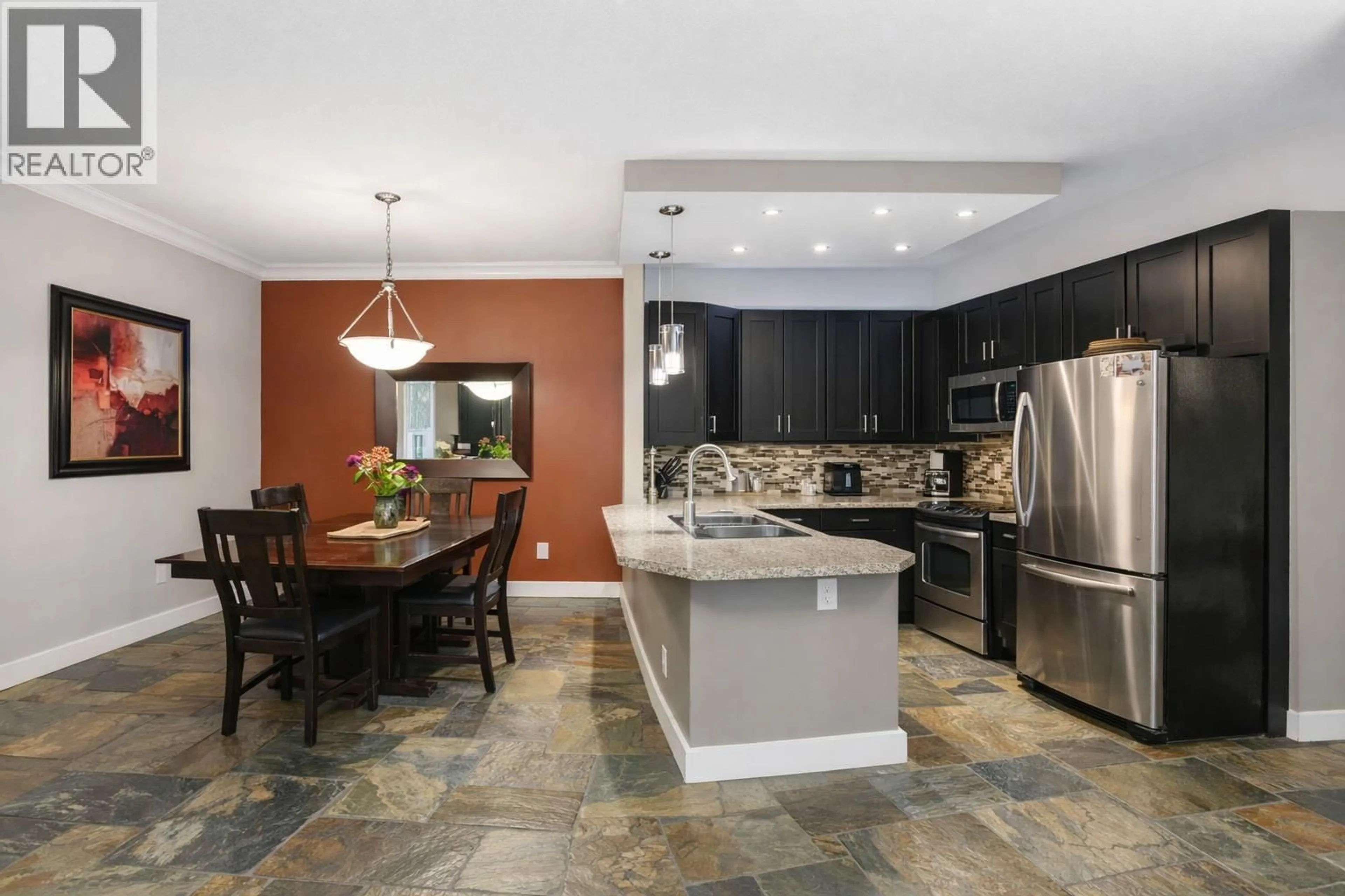 Open concept kitchen, ceramic/tile floor for 103 - 2300 BENVOULIN ROAD, Kelowna British Columbia V1W2C6