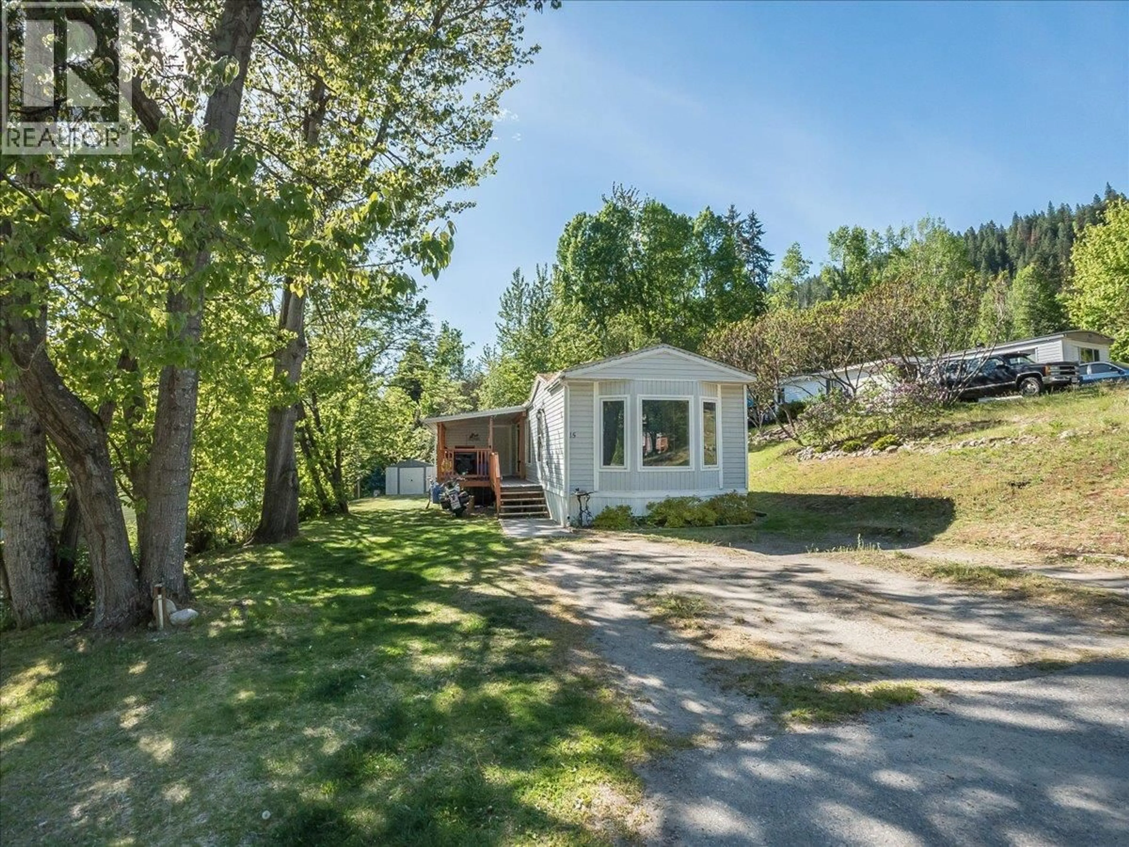 A pic from outside/outdoor area/front of a property/back of a property/a pic from drone, street for 15 - 4029 BROADWATER ROAD, Castlegar British Columbia V1N4V6