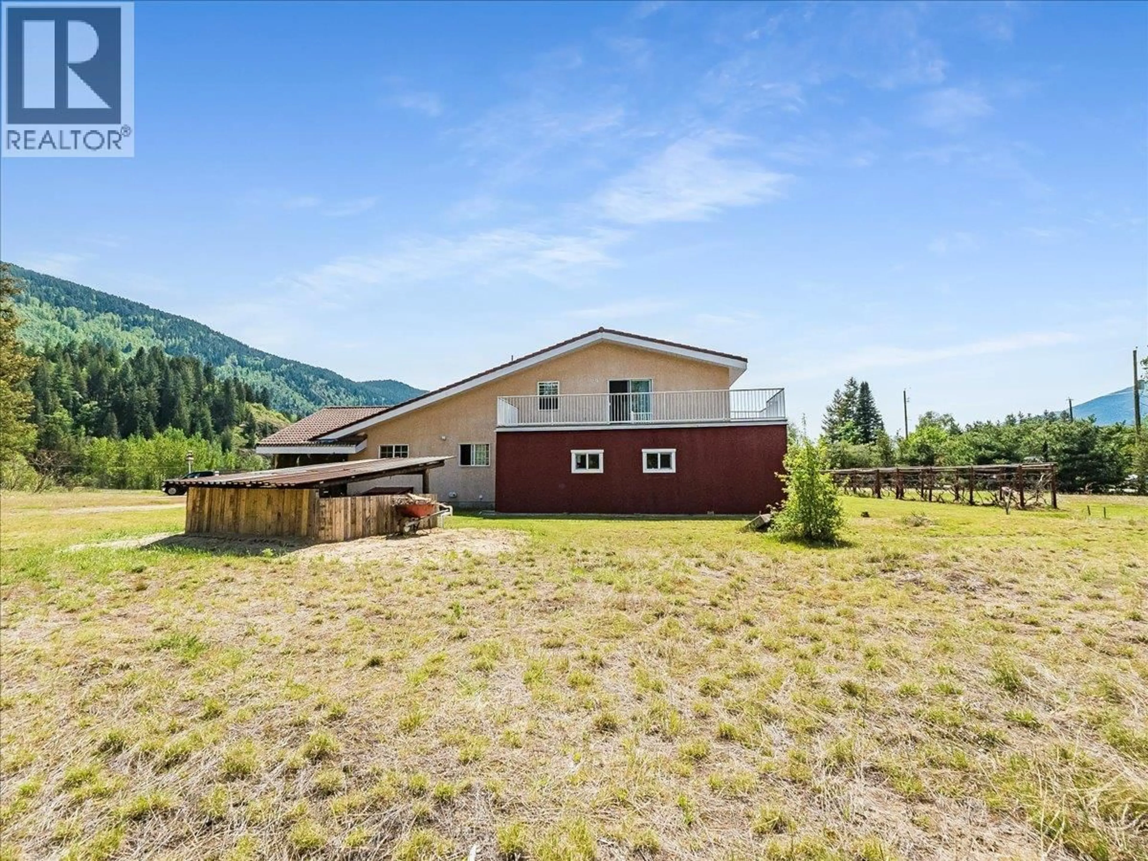 A pic from outside/outdoor area/front of a property/back of a property/a pic from drone, mountain view for 786 PRAIRIE ROAD, Castlegar British Columbia V1N4K6
