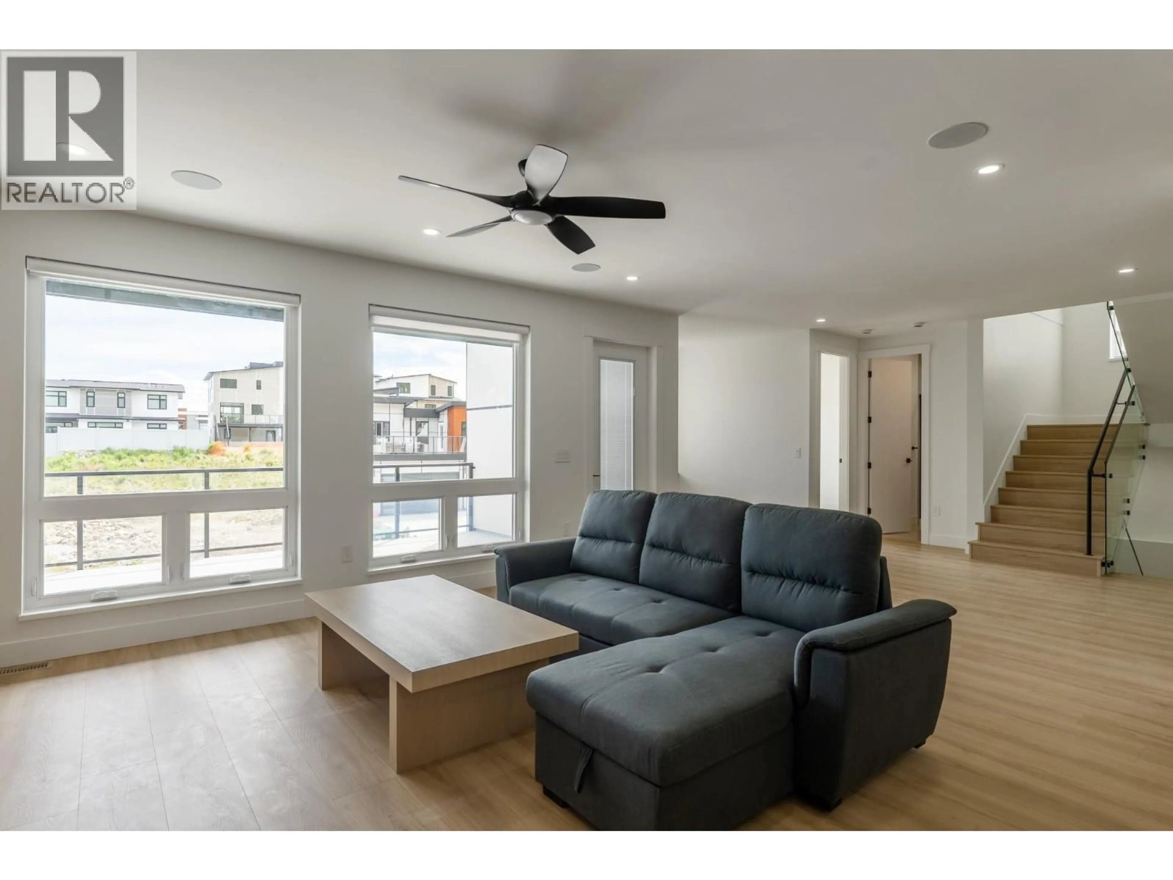 Living room with furniture, wood/laminate floor for 3754 ASTORIA DRIVE, West Kelowna British Columbia V4T0B1