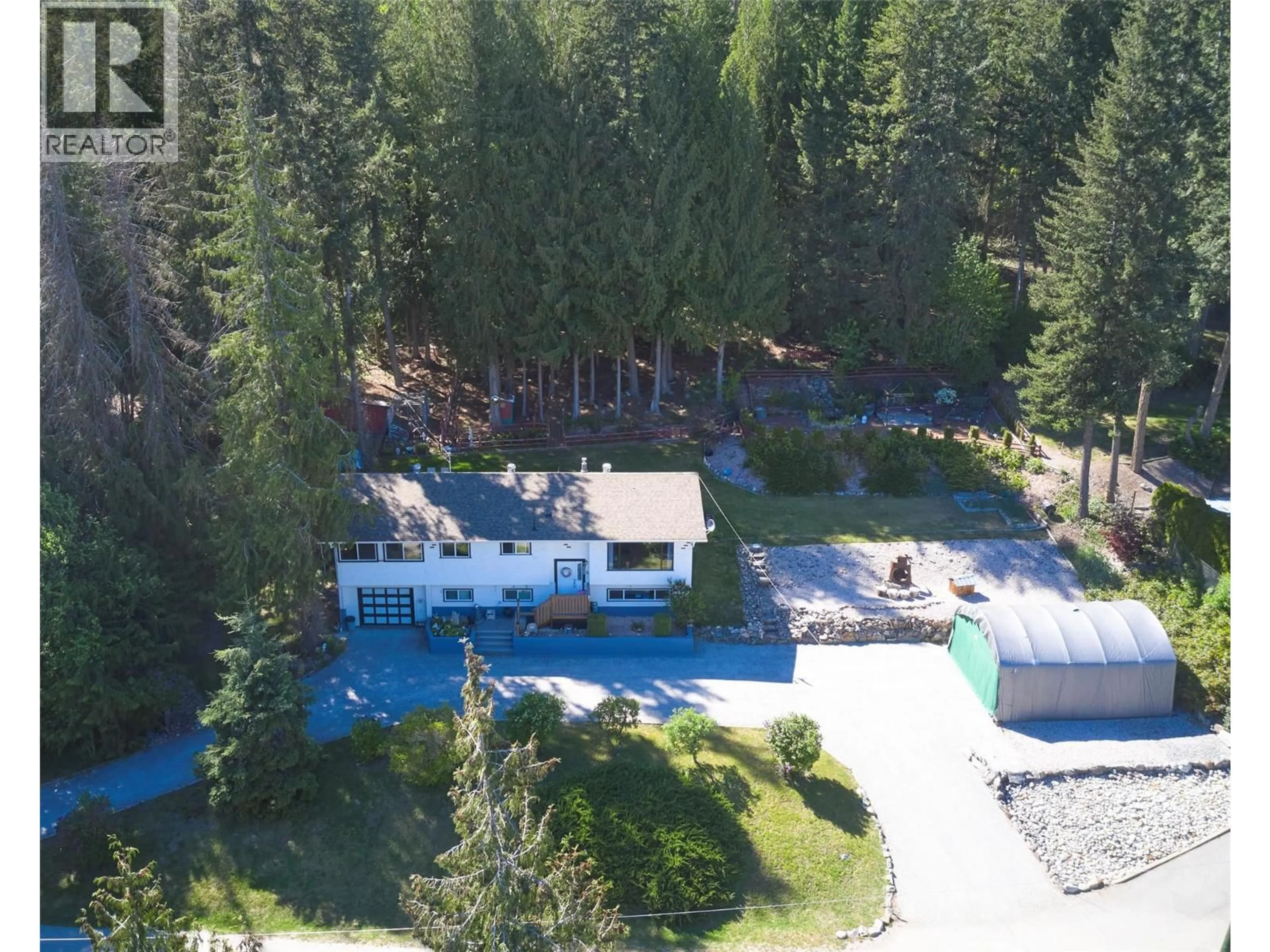 A pic from outside/outdoor area/front of a property/back of a property/a pic from drone, forest/trees view for 122 TIMBERLANE ROAD, Enderby British Columbia V4Y4G1