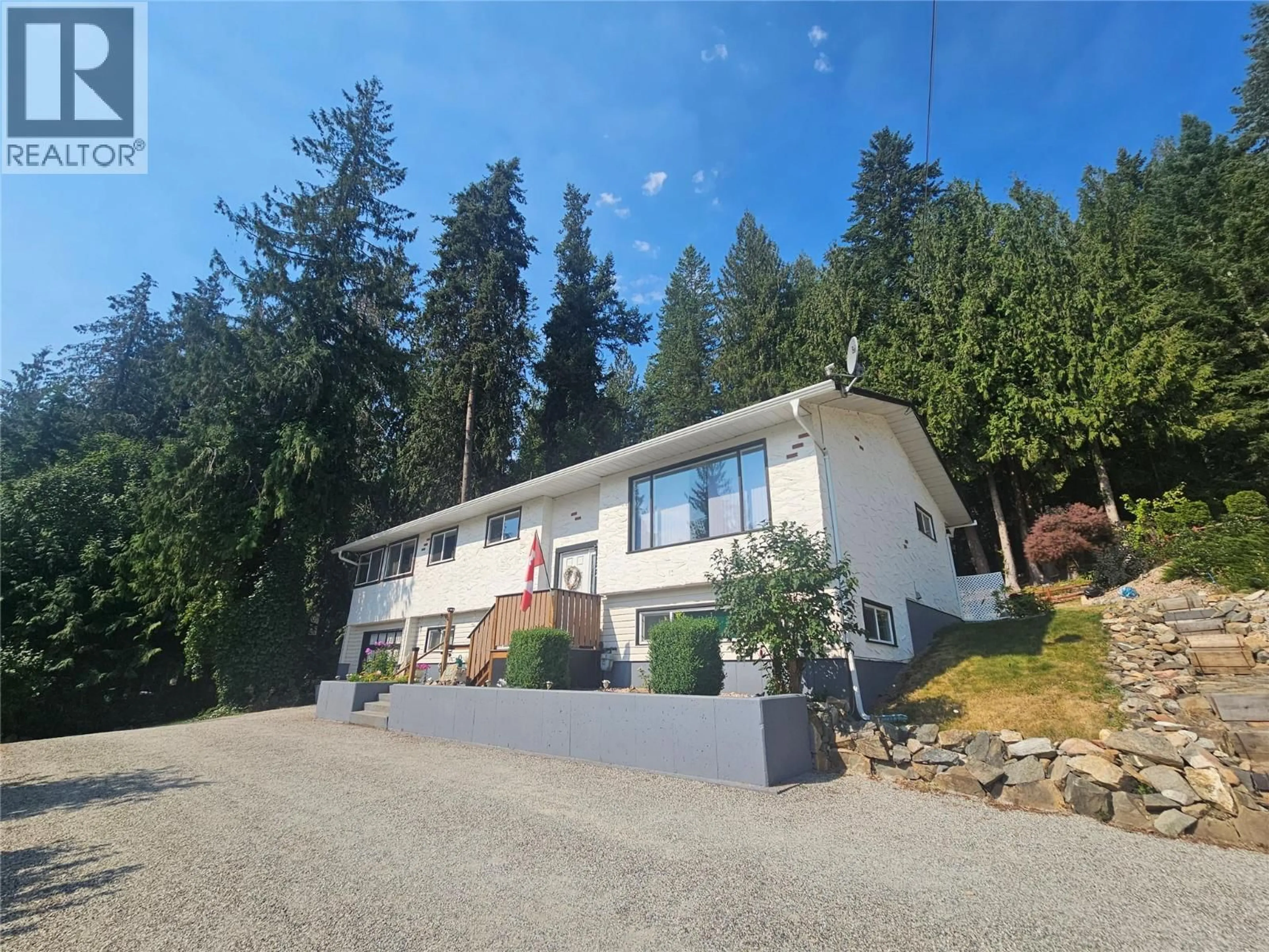A pic from outside/outdoor area/front of a property/back of a property/a pic from drone, mountain view for 122 TIMBERLANE ROAD, Enderby British Columbia V4Y4G1