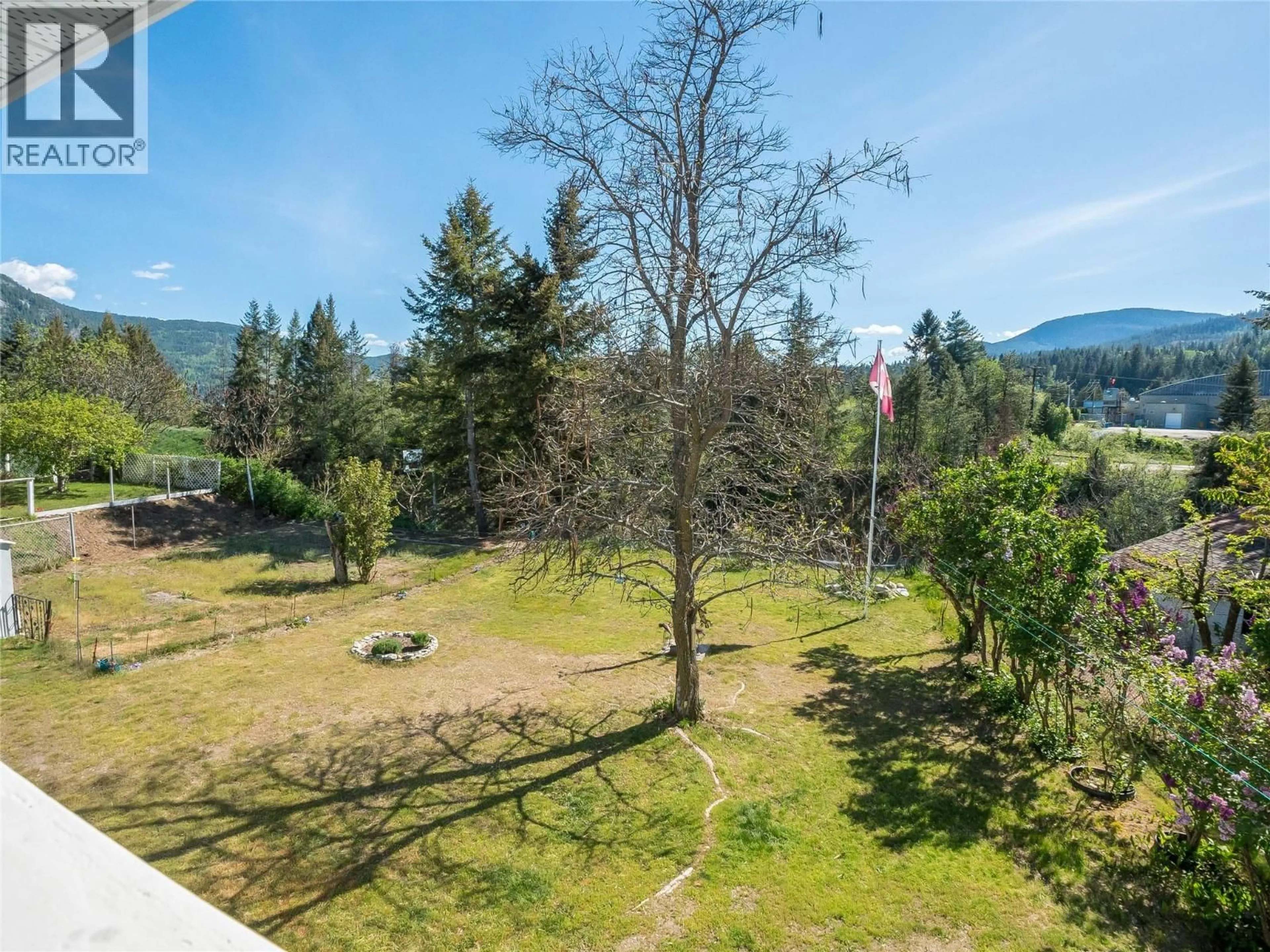 A pic from outside/outdoor area/front of a property/back of a property/a pic from drone, forest/trees view for 1937 RIVERSIDE CRESCENT, Castlegar British Columbia V1N3W5