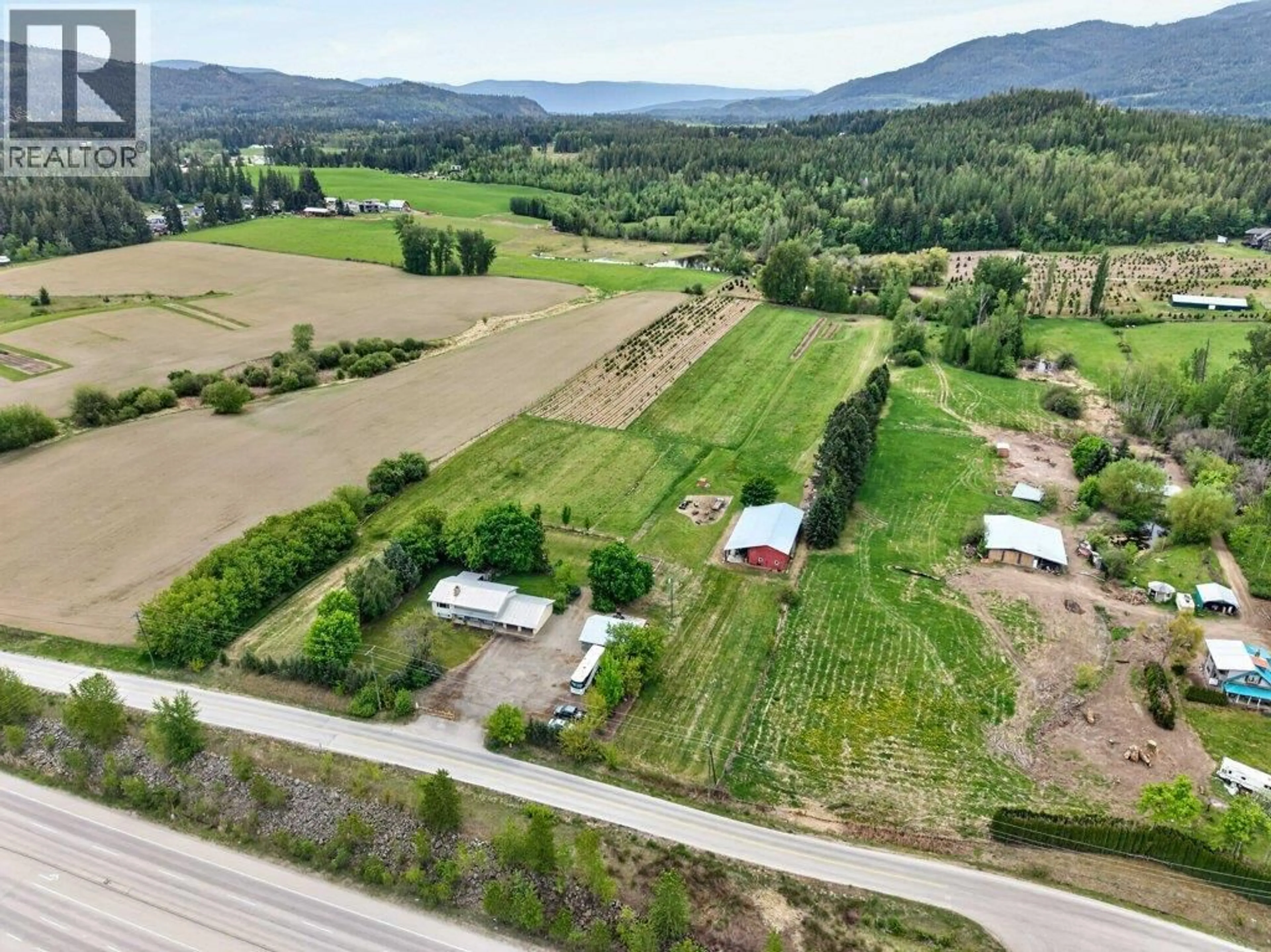 A pic from outside/outdoor area/front of a property/back of a property/a pic from drone, mountain view for 3930 10 AVENUE NORTHEAST, Salmon Arm British Columbia V1E2S2
