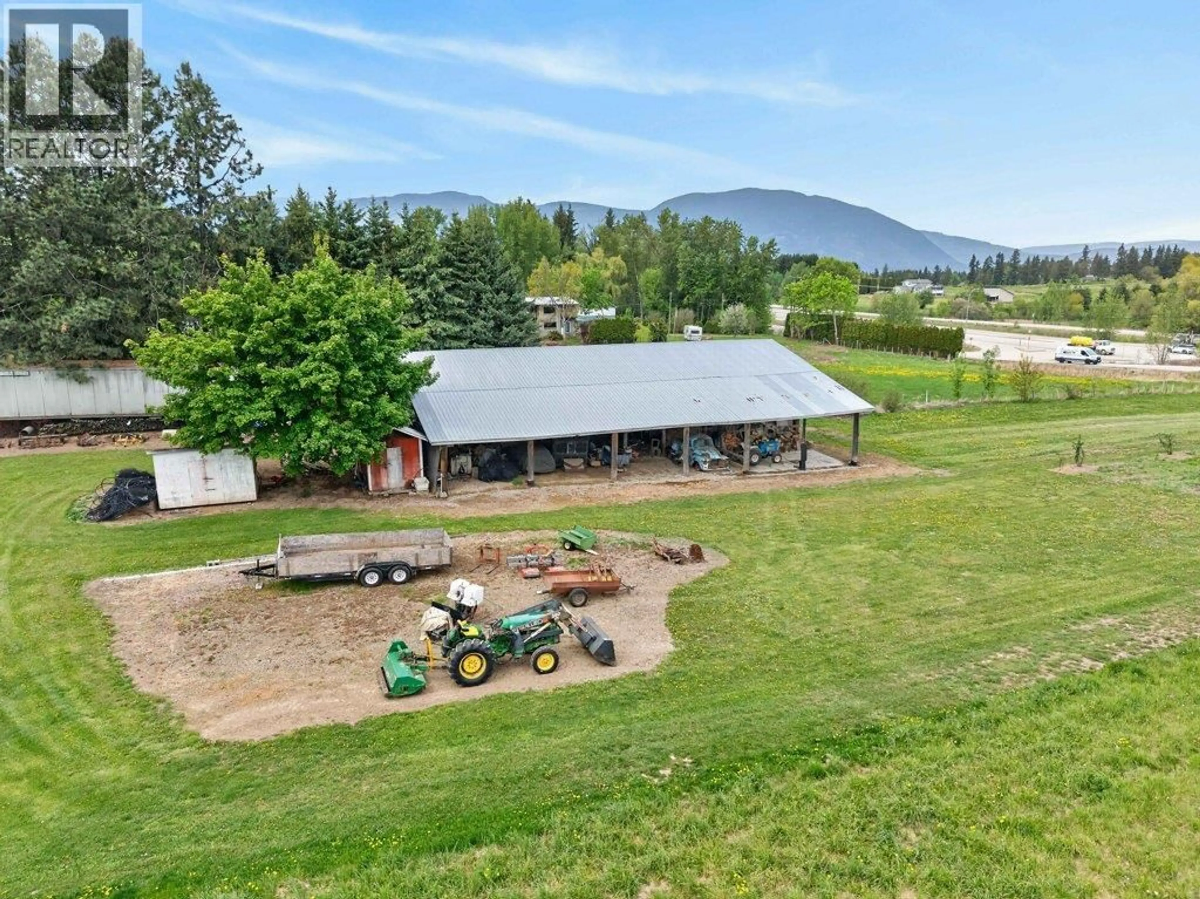 A pic from outside/outdoor area/front of a property/back of a property/a pic from drone, mountain view for 3930 10 AVENUE NORTHEAST, Salmon Arm British Columbia V1E2S2