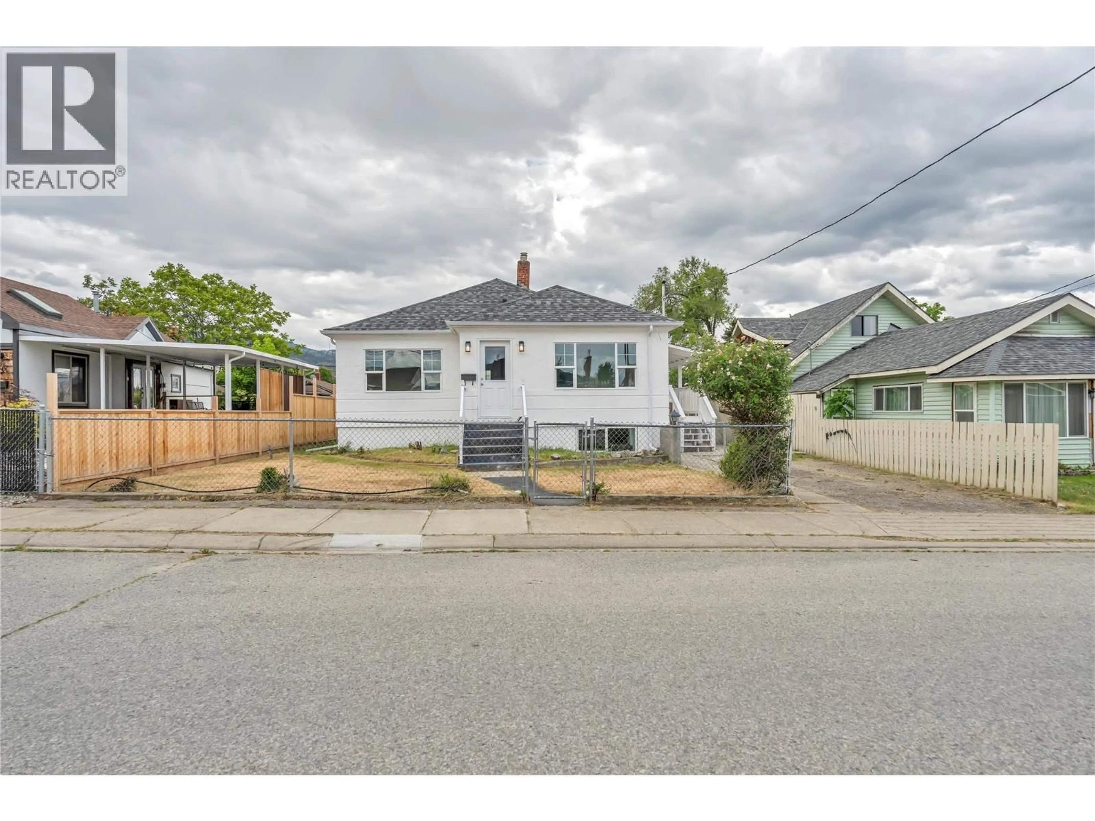 A pic from outside/outdoor area/front of a property/back of a property/a pic from drone, street for 460 PENTICTON AVENUE, Penticton British Columbia V2A2M6