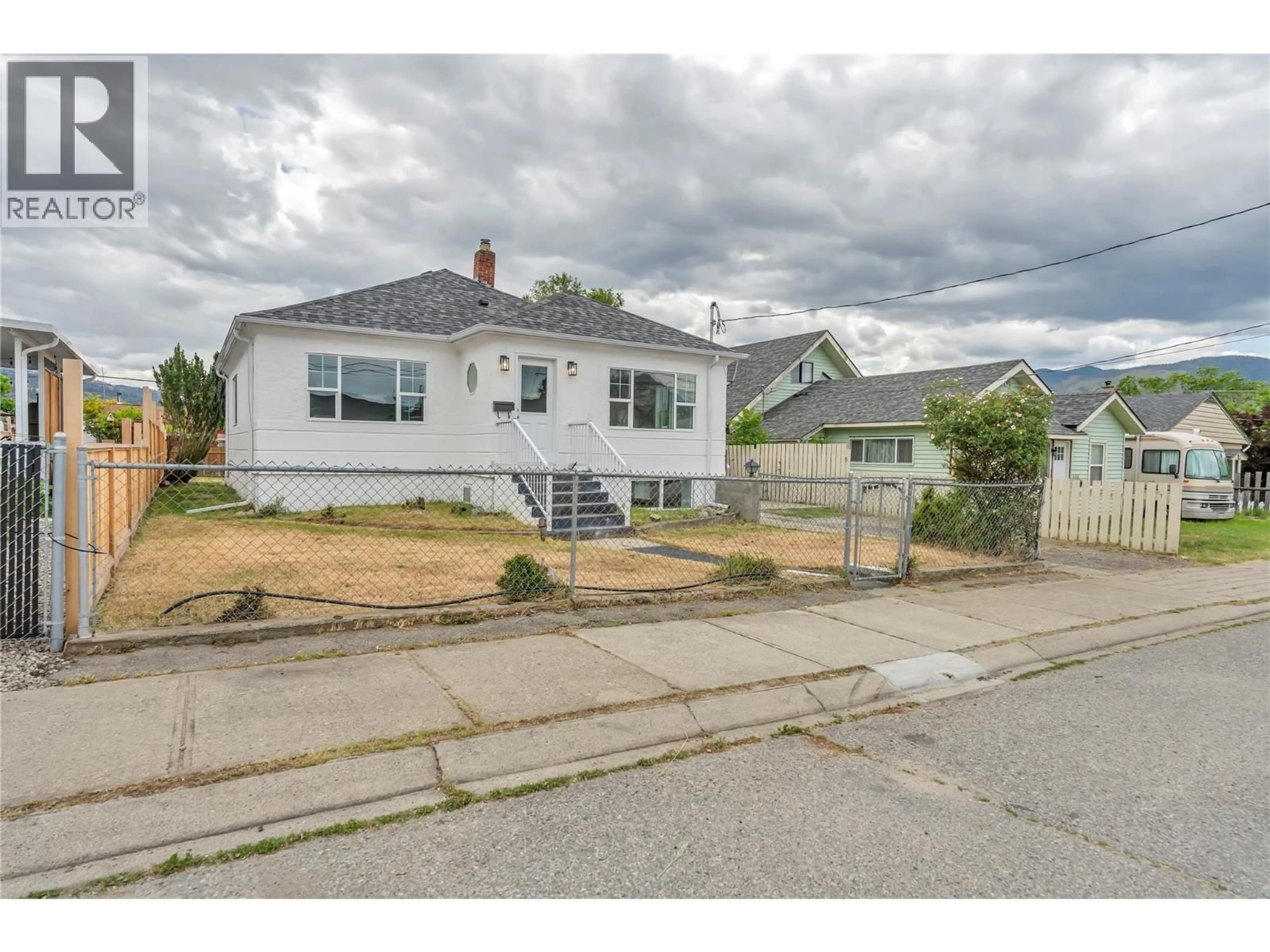 A pic from outside/outdoor area/front of a property/back of a property/a pic from drone, street for 460 PENTICTON AVENUE, Penticton British Columbia V2A2M6
