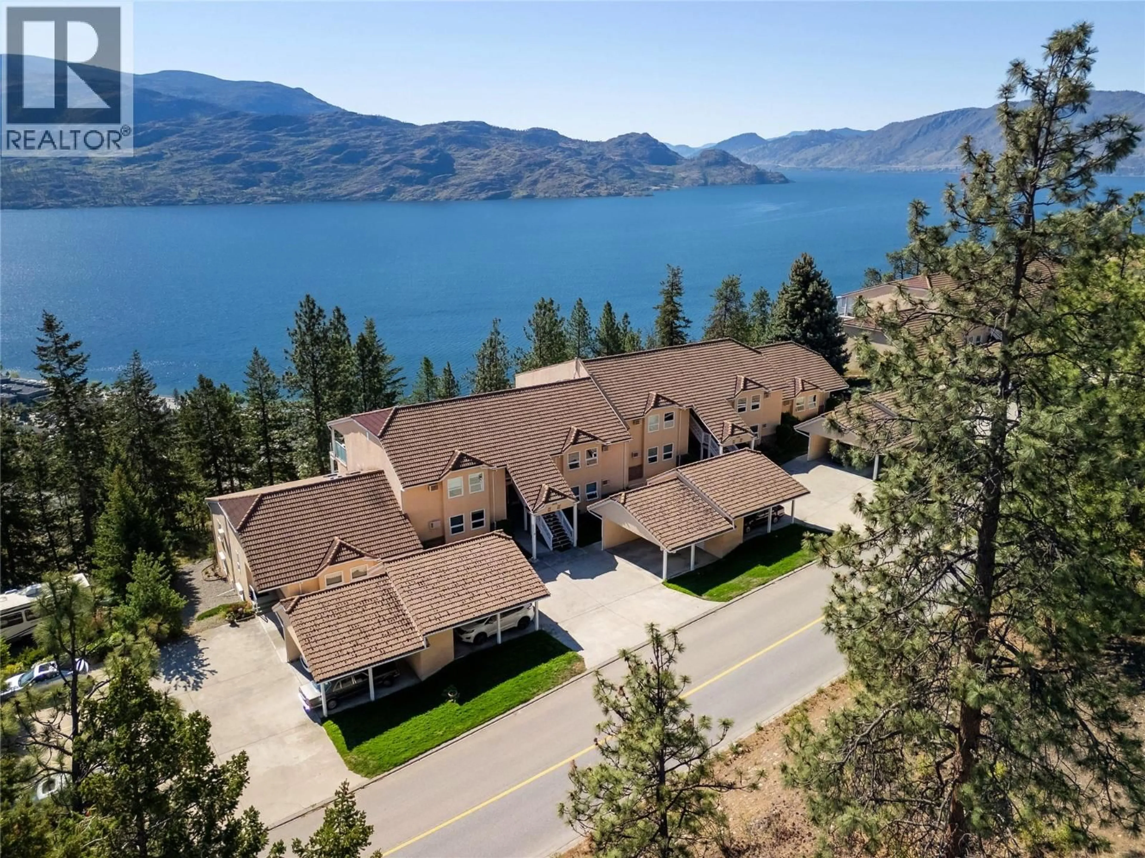 A pic from outside/outdoor area/front of a property/back of a property/a pic from drone, water/lake/river/ocean view for 102 - 4450 PONDEROSA DRIVE, Peachland British Columbia V0H1X5