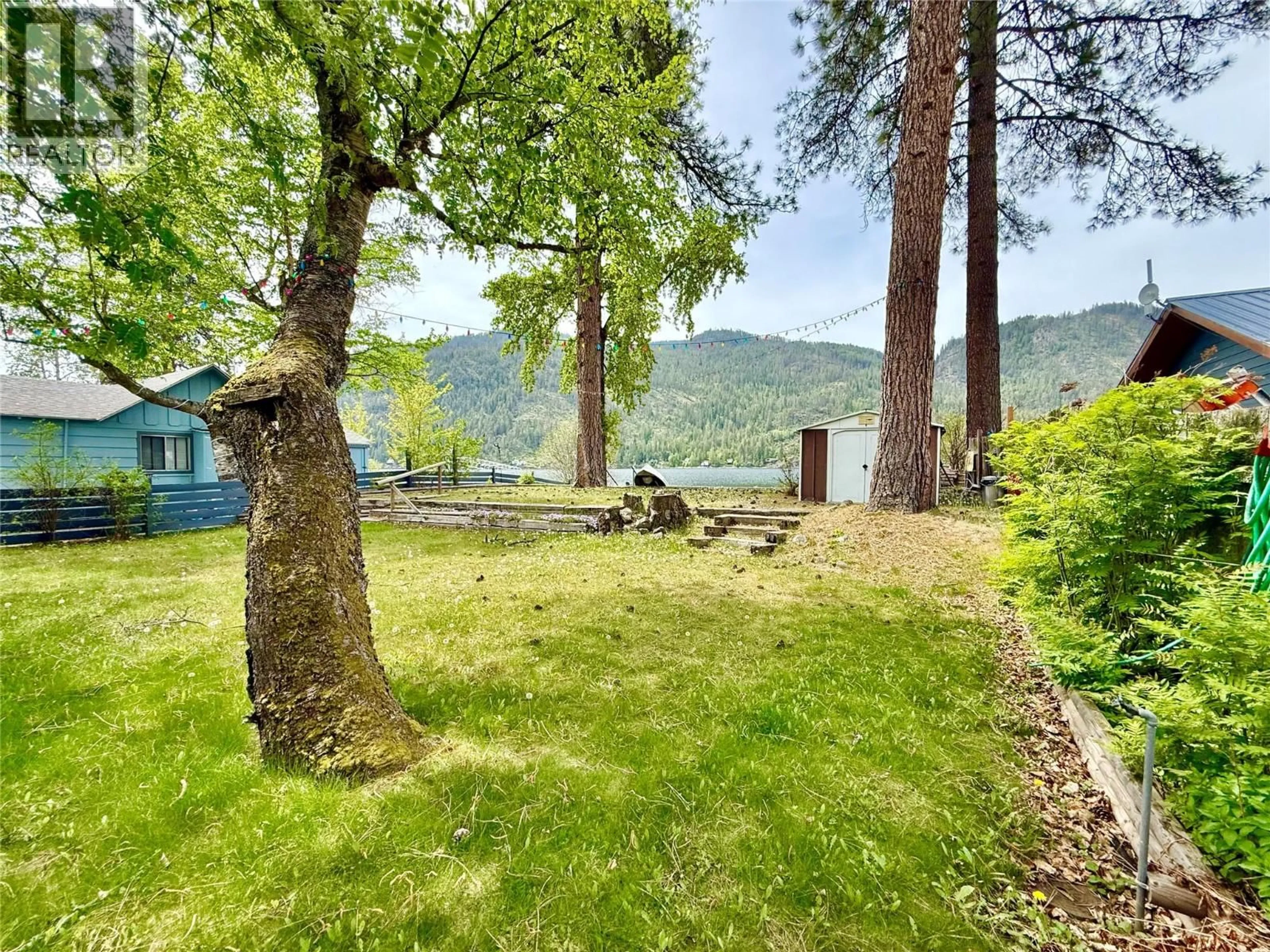 A pic from outside/outdoor area/front of a property/back of a property/a pic from drone, water/lake/river/ocean view for 189 ALPINE ROAD, Christina Lake British Columbia V0H1E1