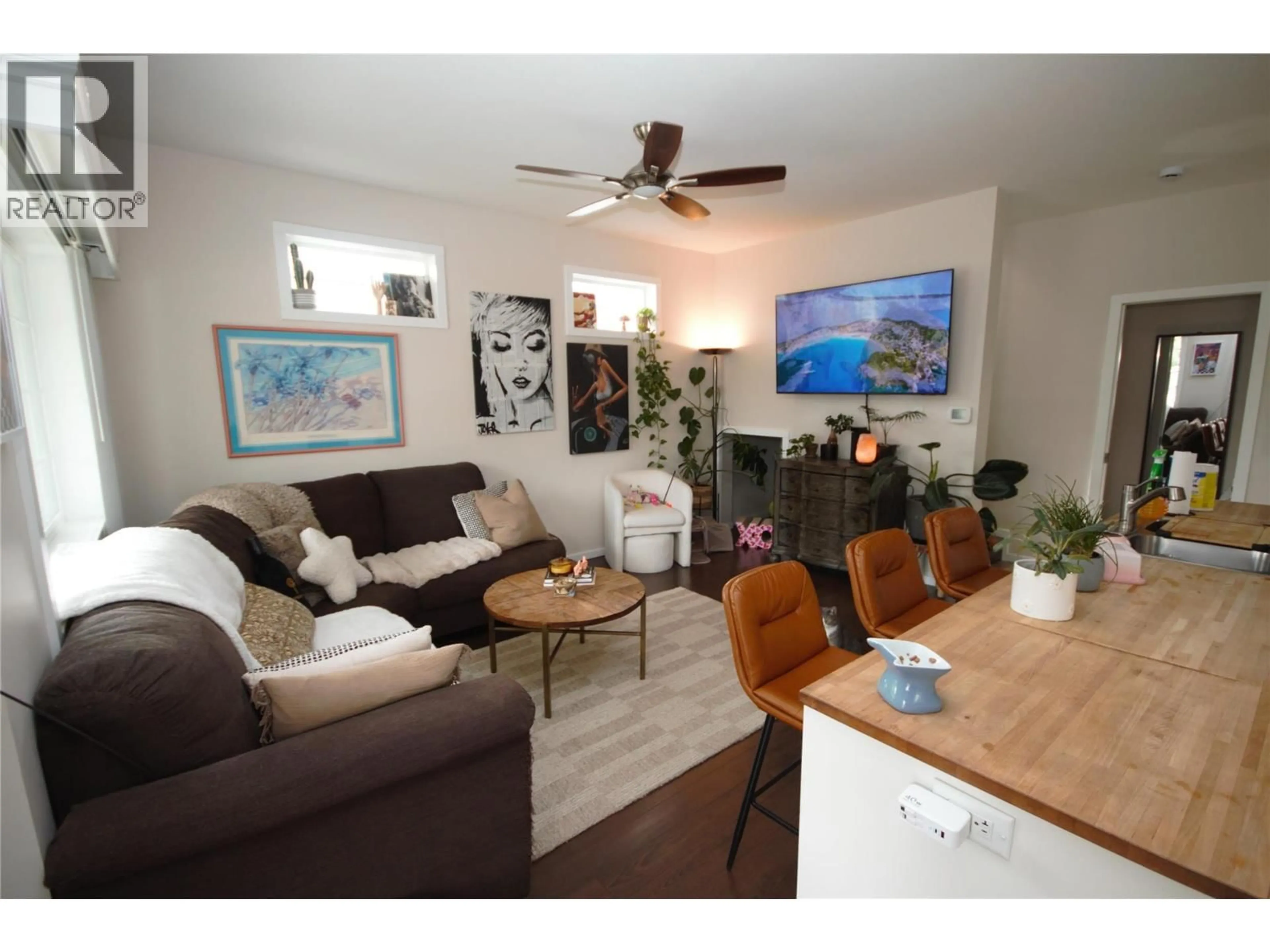 Living room with furniture, wood/laminate floor for 6466 PARK DRIVE, Oliver British Columbia V0H1T3