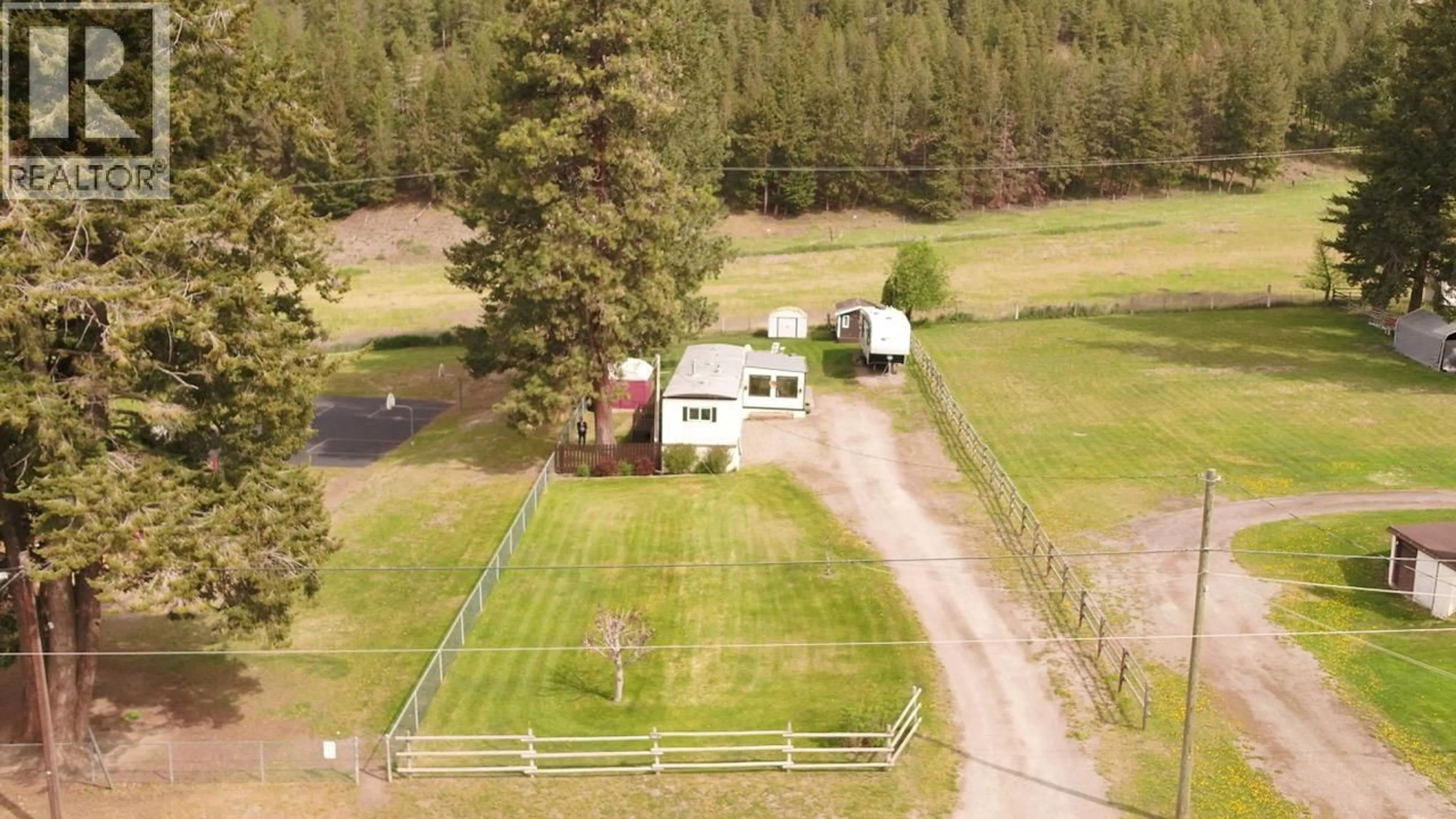 A pic from outside/outdoor area/front of a property/back of a property/a pic from drone, mountain view for 5708 TUKTAKAMIN ROAD, Falkland British Columbia V0E1W0