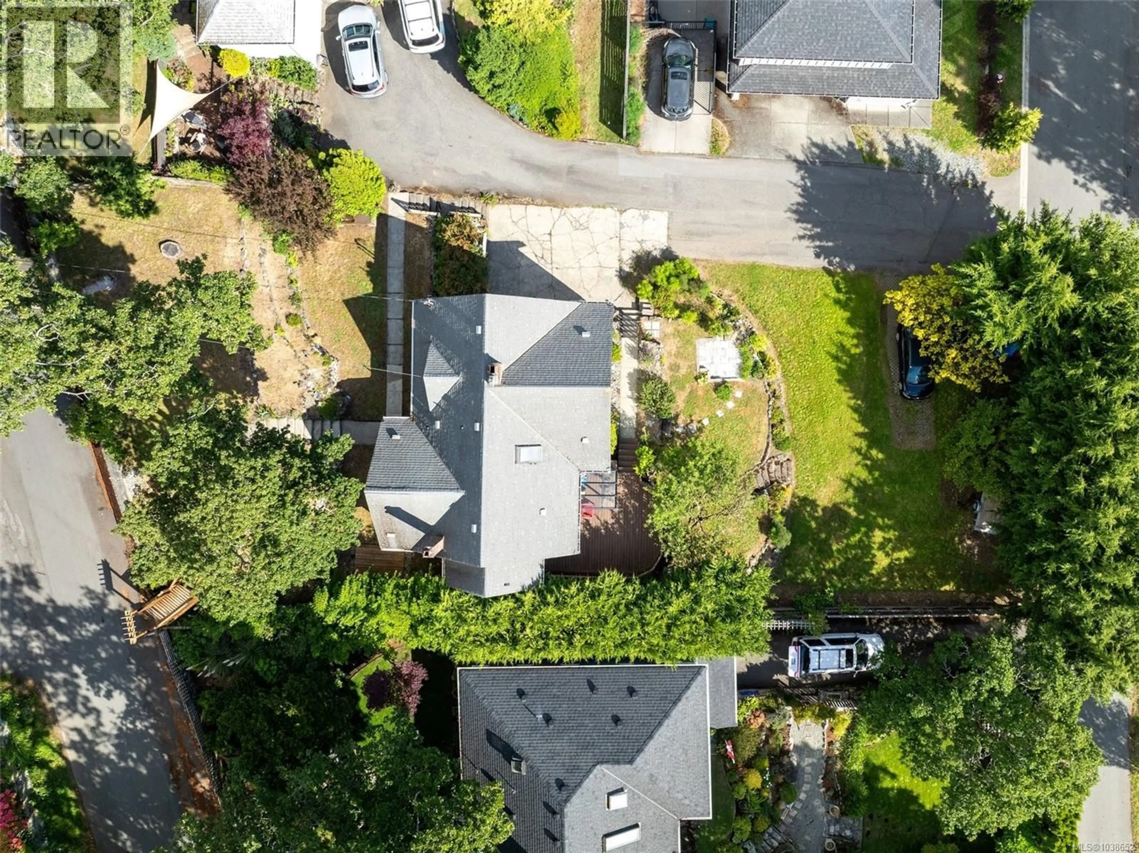A pic from outside/outdoor area/front of a property/back of a property/a pic from drone, street for 1161 CLOVELLY TERRACE, Saanich British Columbia V8P1V7