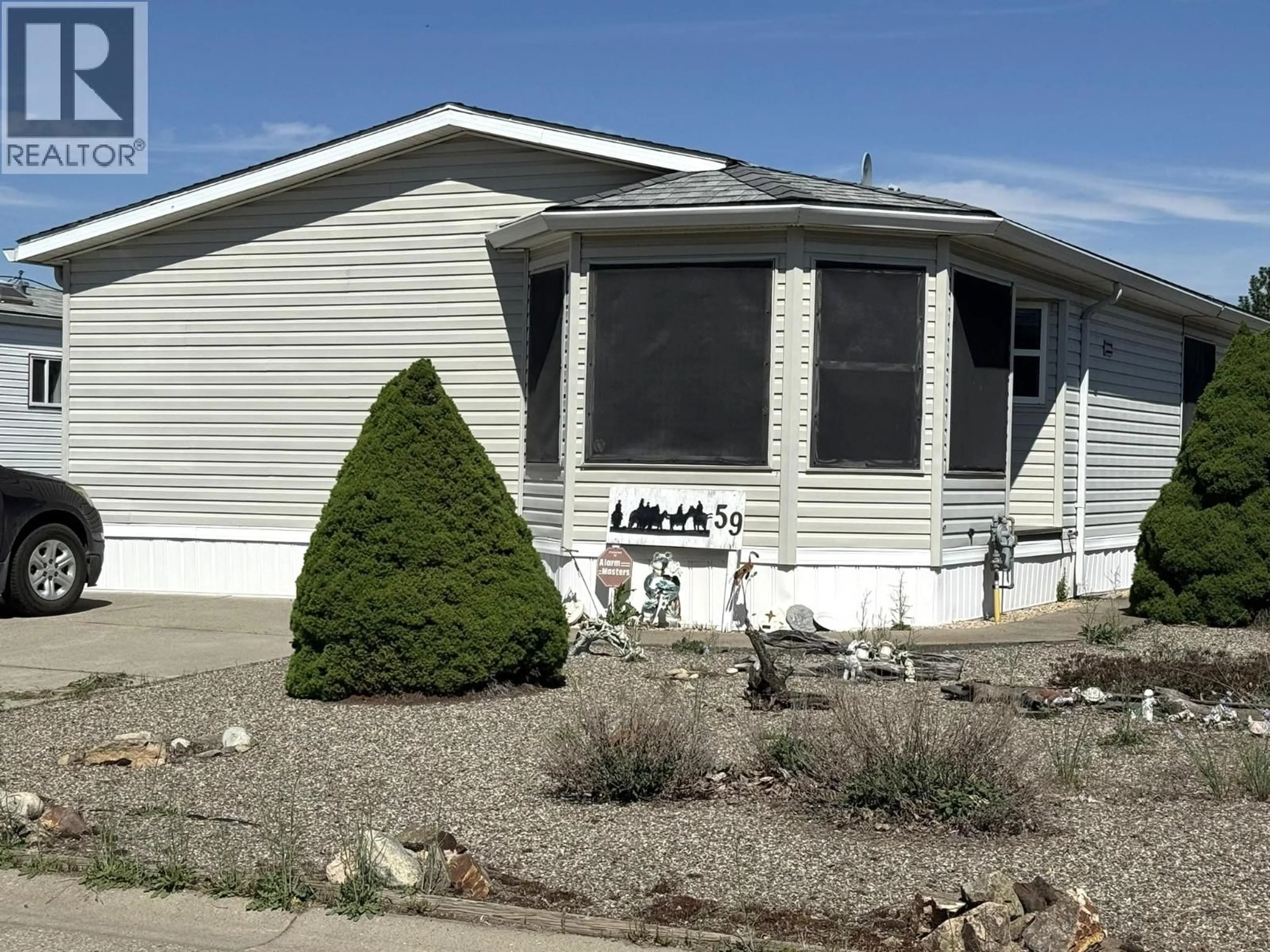 Home with vinyl exterior material, street for 59 - 9510 HIGHWAY 97N OTHER, Vernon British Columbia V1H1R8
