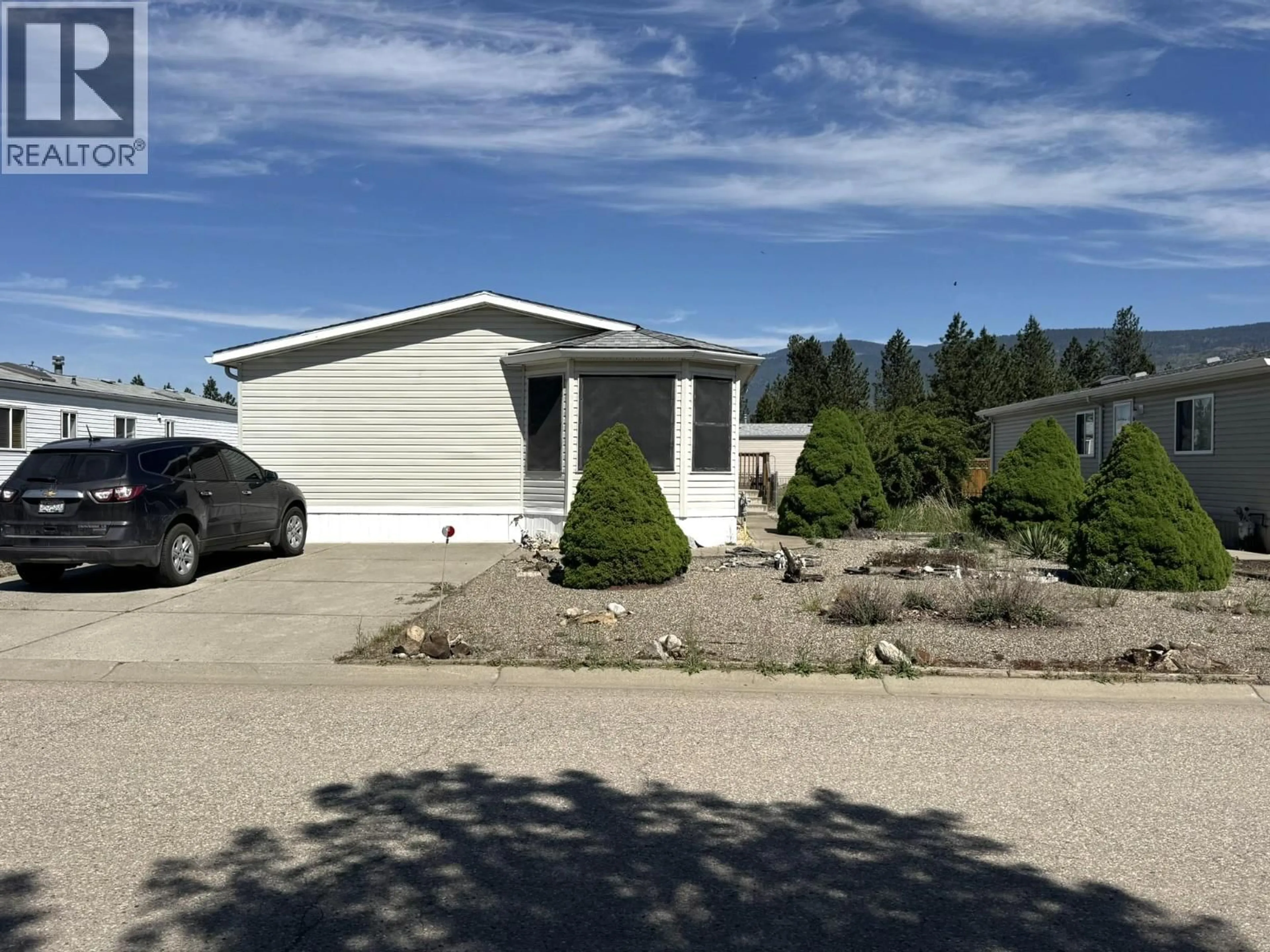 Home with vinyl exterior material, street for 59 - 9510 HIGHWAY 97N OTHER, Vernon British Columbia V1H1R8