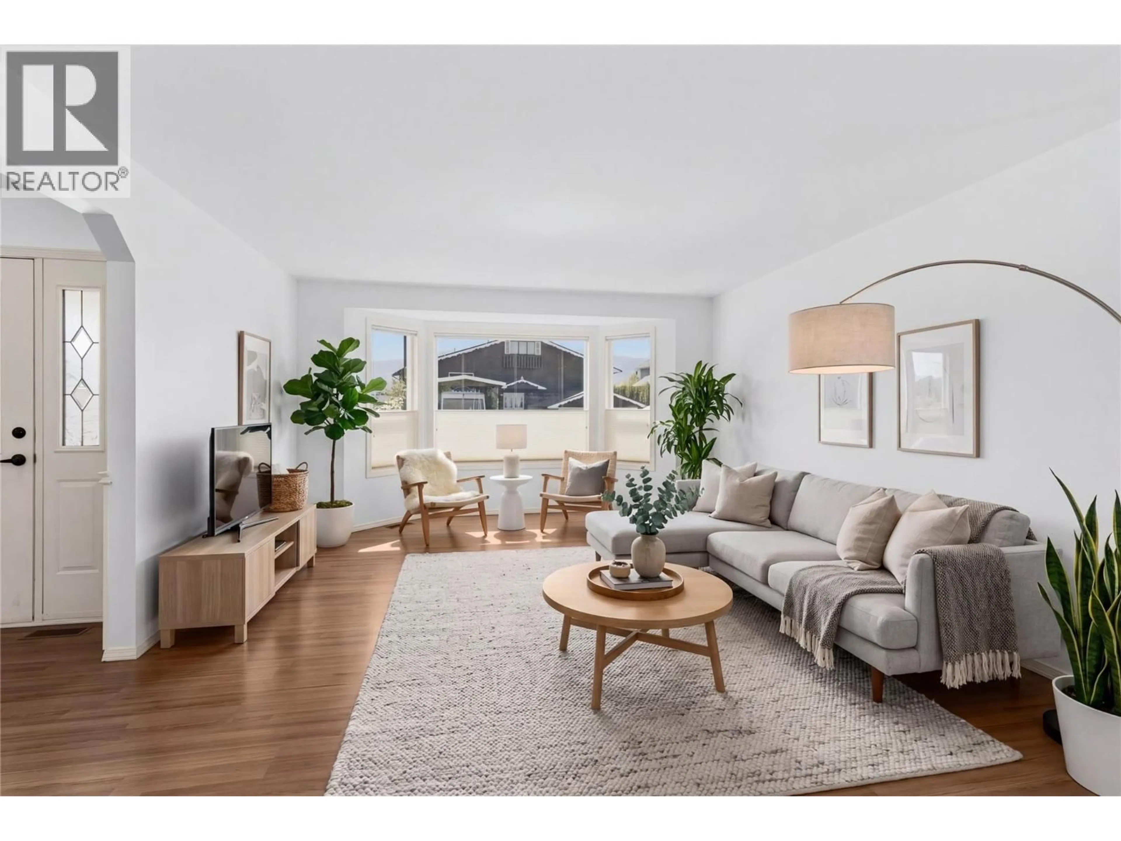 Living room with furniture, wood/laminate floor for 3980 MILFORD ROAD, West Kelowna British Columbia V4T1X2