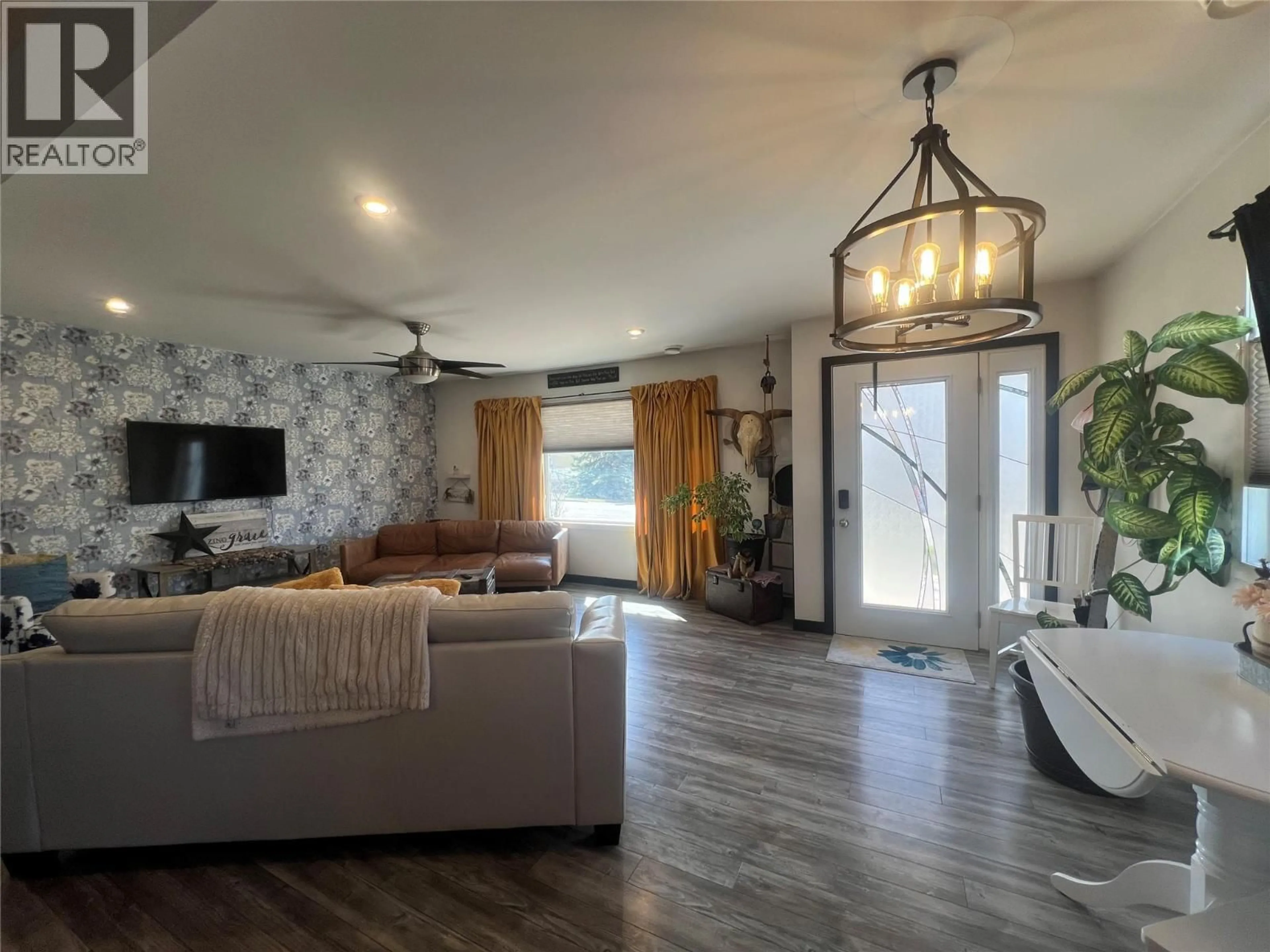 Living room with furniture, wood/laminate floor for 1116 96A AVENUE, Dawson Creek British Columbia V1G1M8