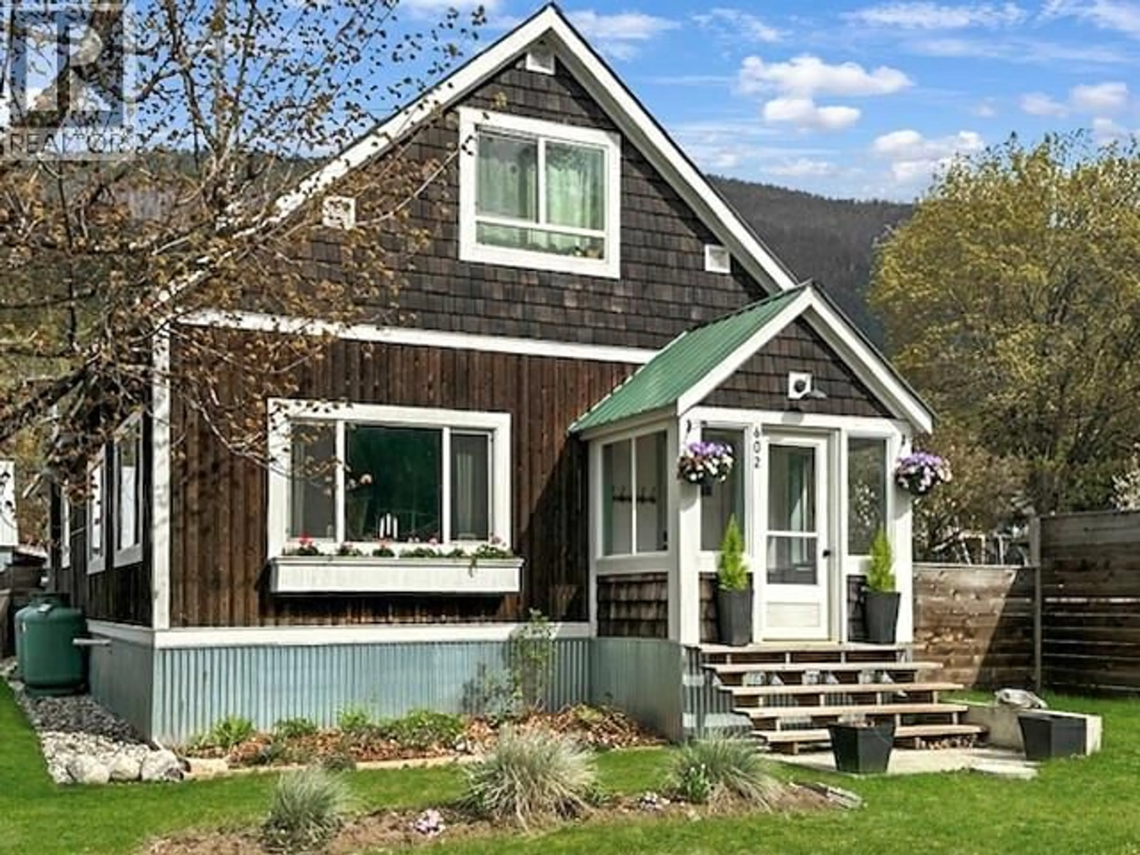 Home with vinyl exterior material, street for 602 SLOCAN STREET, Slocan British Columbia V0G2C0