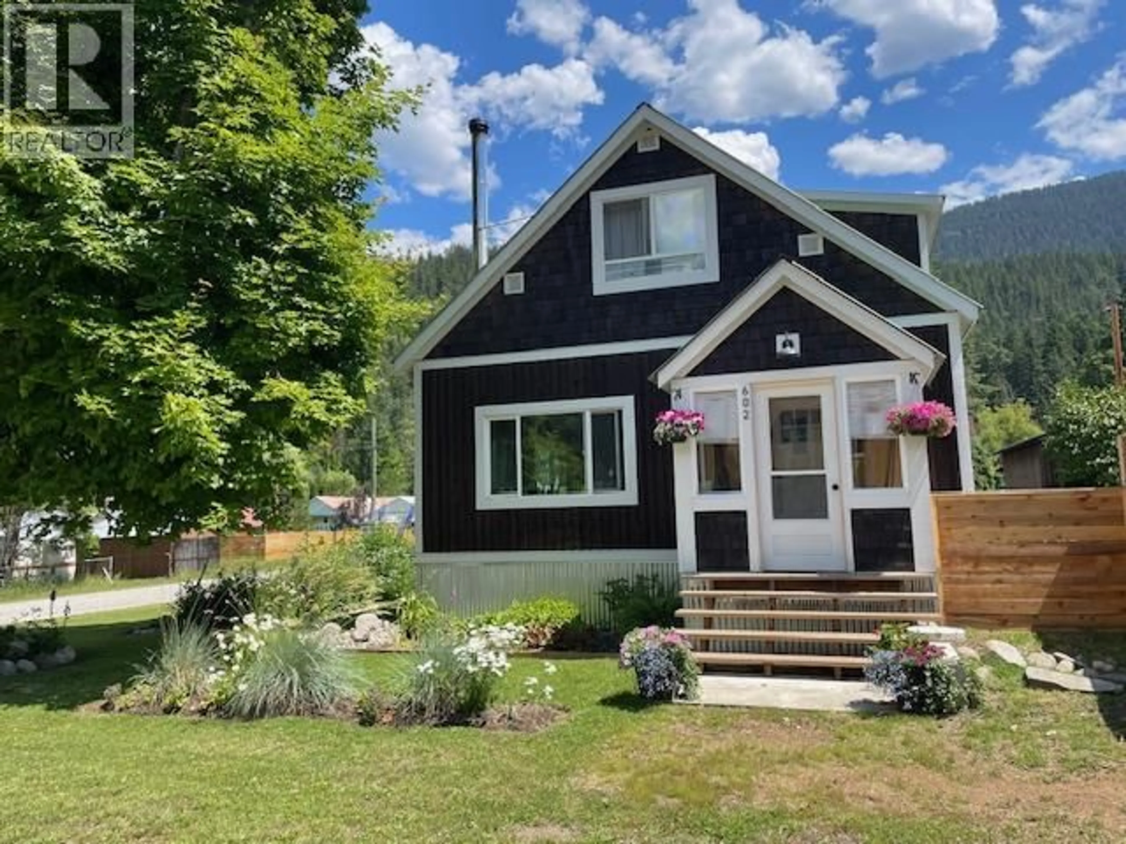 Home with vinyl exterior material, street for 602 SLOCAN STREET, Slocan British Columbia V0G2C0