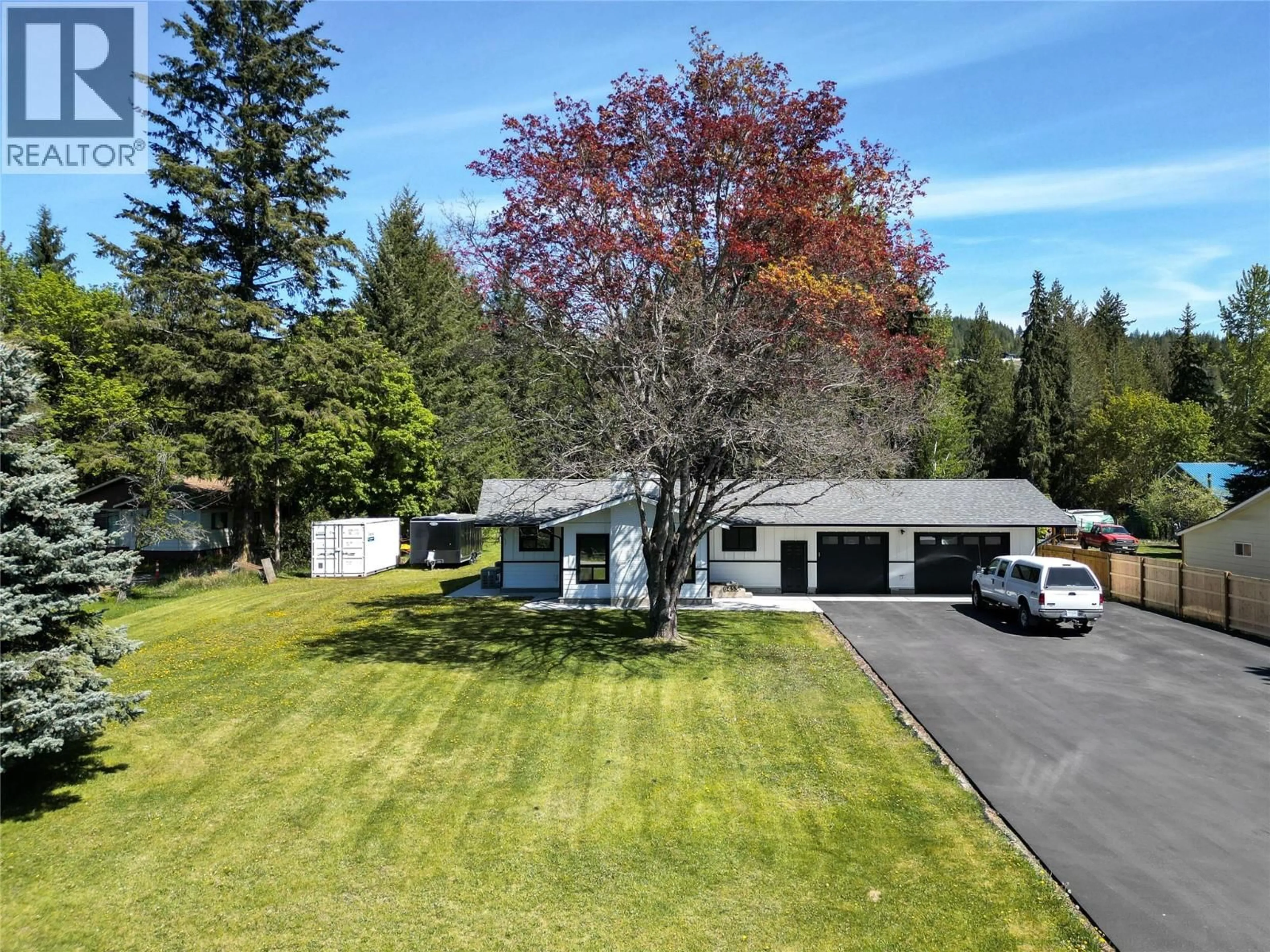 A pic from outside/outdoor area/front of a property/back of a property/a pic from drone, unknown for 6453 RANCHERO DRIVE, Salmon Arm British Columbia V1E2R1
