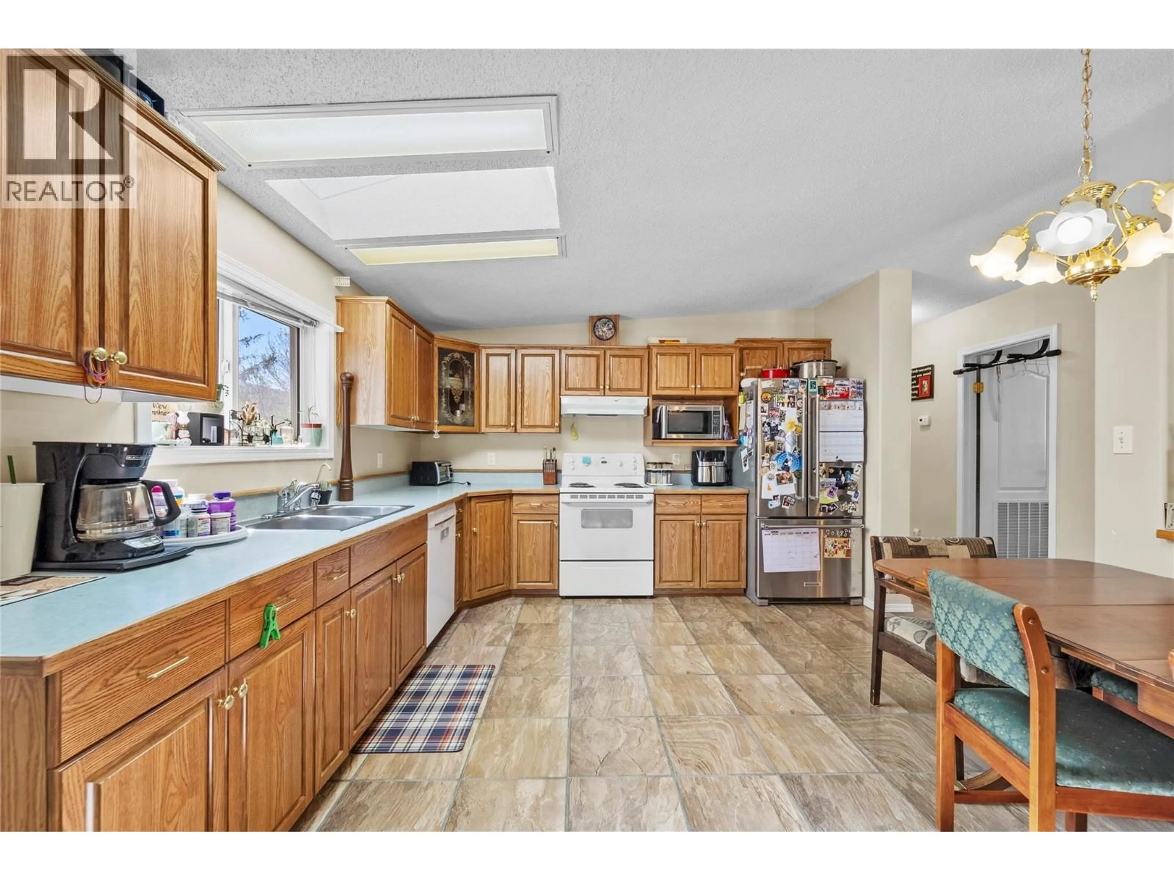 Open concept kitchen, ceramic/tile floor for 1309 SPRUCE AVENUE, Merritt British Columbia V1K1L2