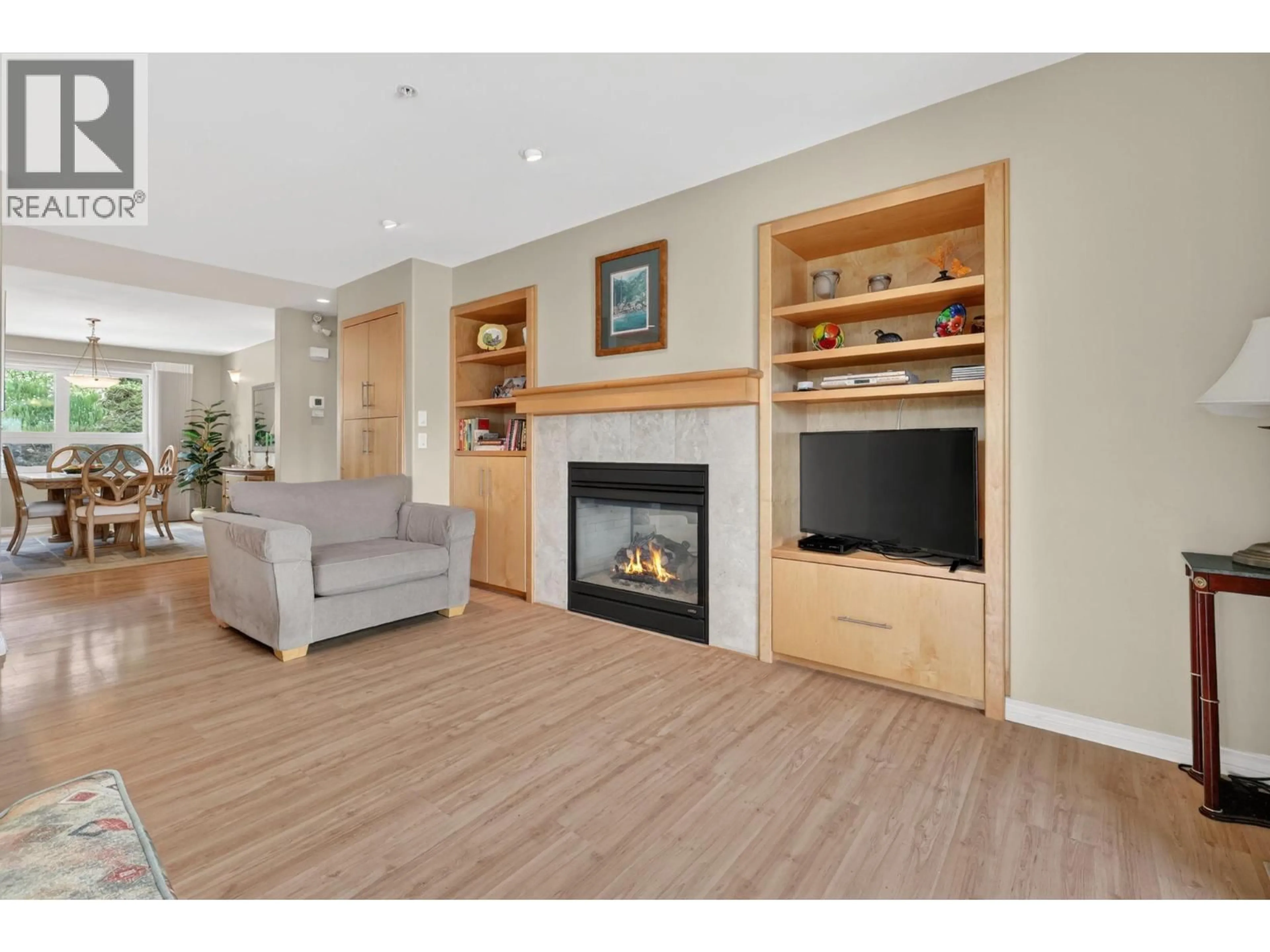 Living room with furniture, wood/laminate floor for 6226 HEIGHWAY LANE, Peachland British Columbia V0H1X7