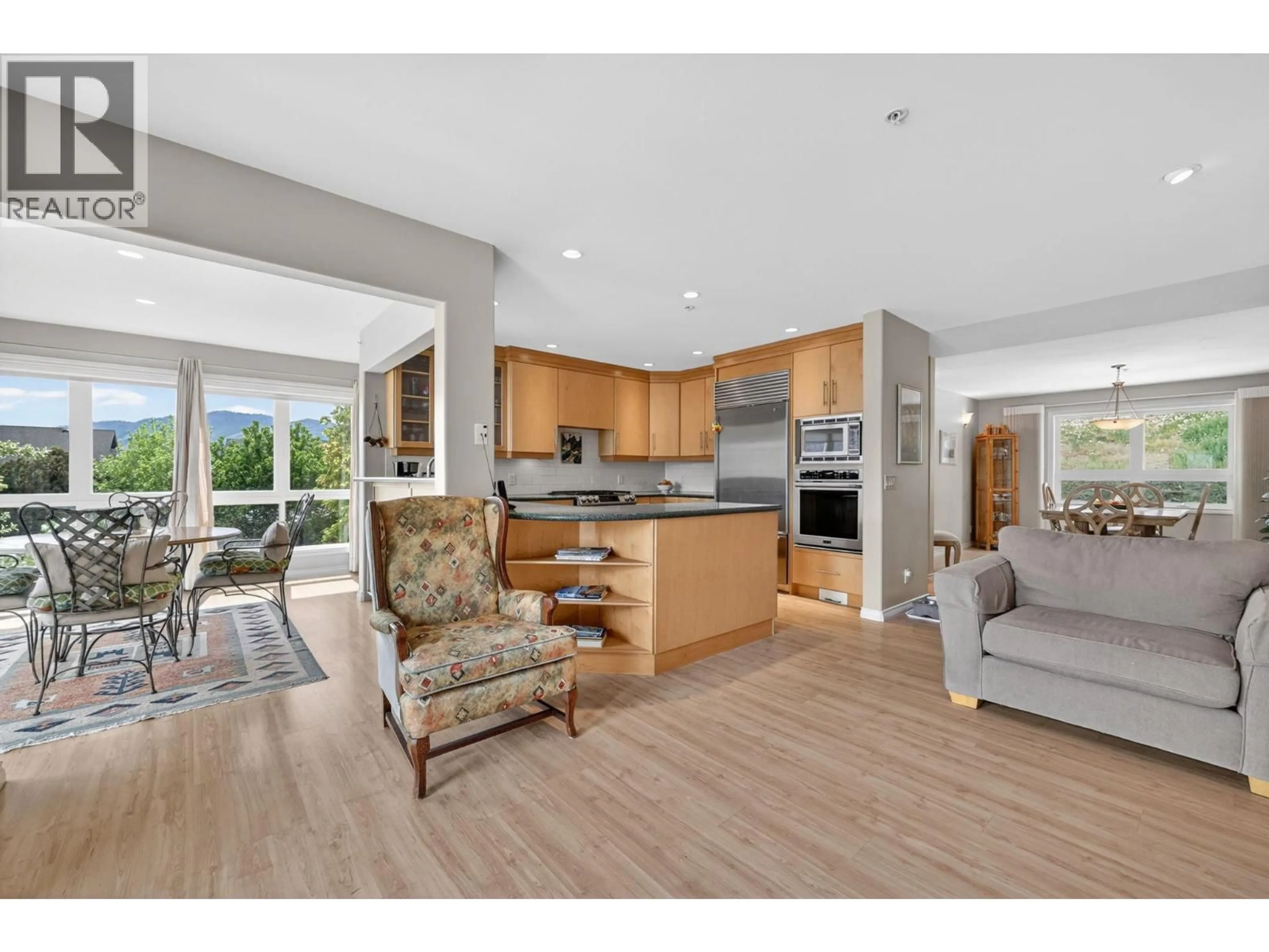 Open concept kitchen, wood/laminate floor for 6226 HEIGHWAY LANE, Peachland British Columbia V0H1X7