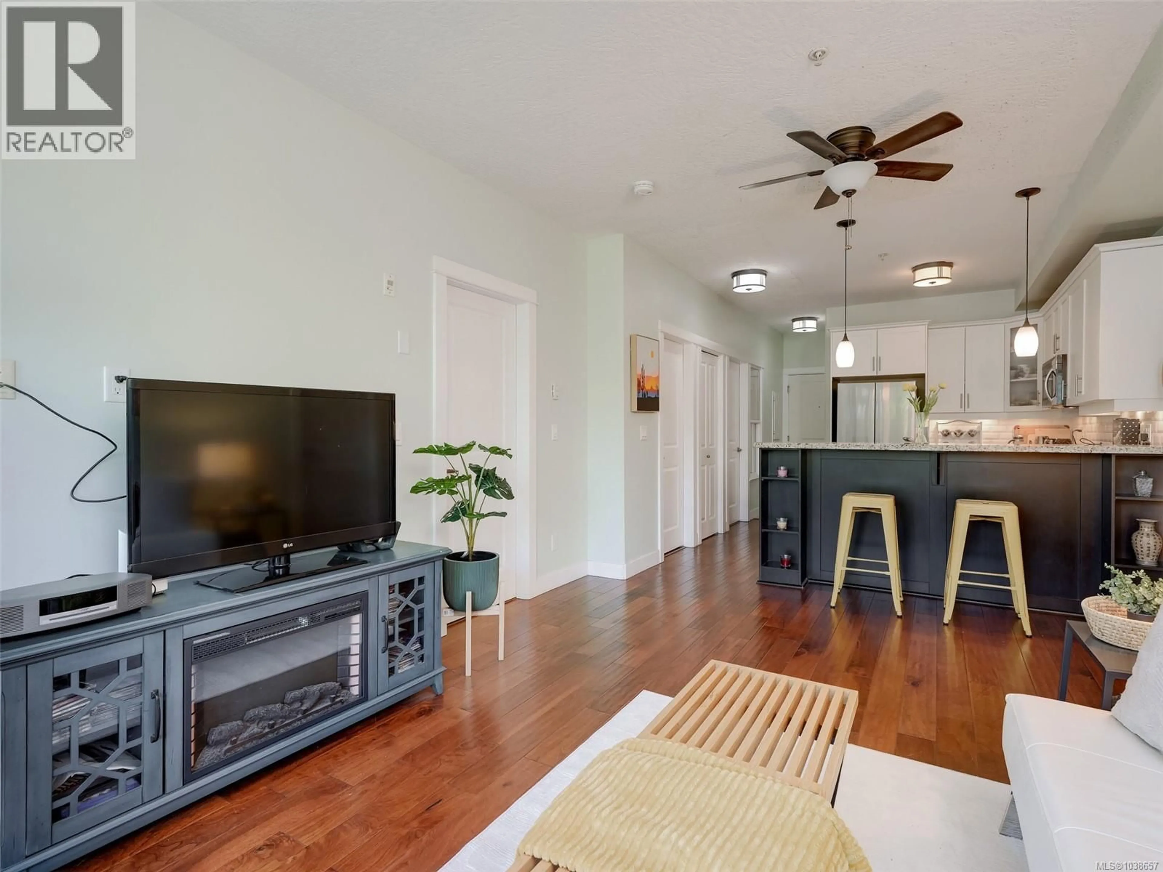 Living room with furniture, wood/laminate floor for 218 - 2710 JACKLIN ROAD, Langford British Columbia V9B0K5