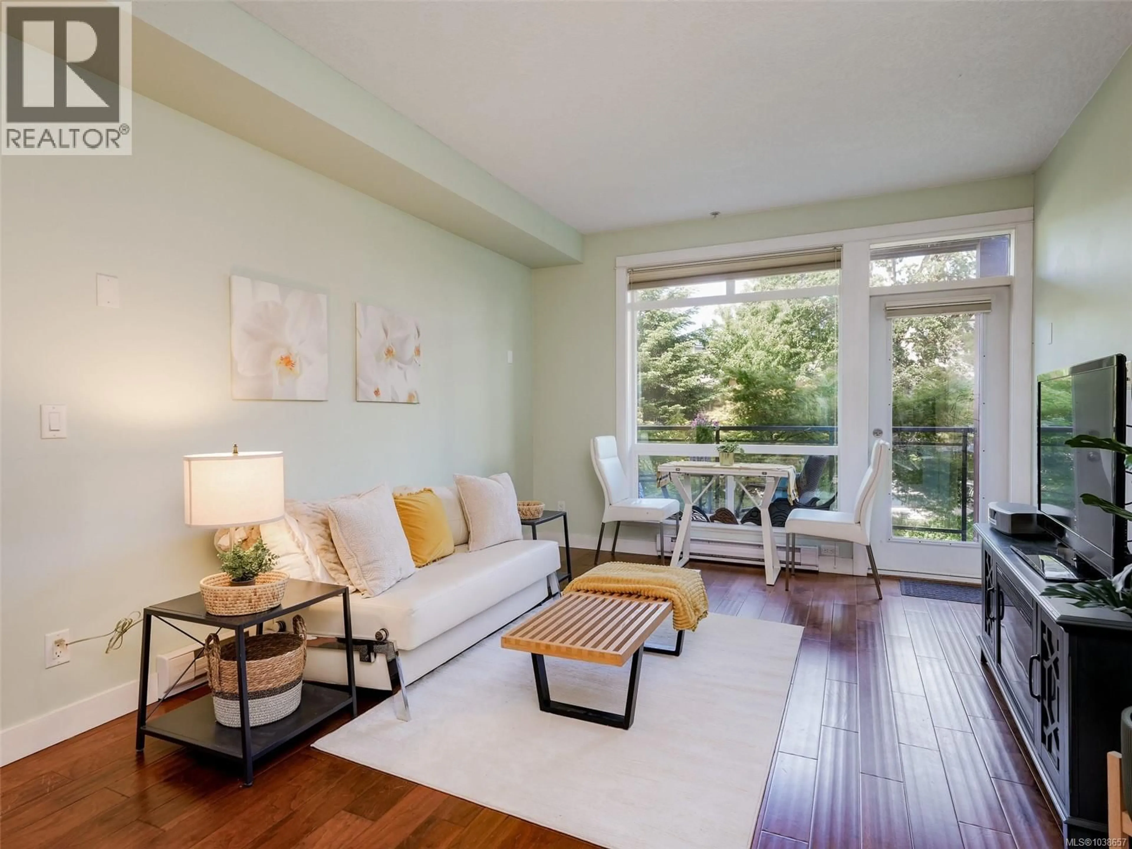 Living room with furniture, wood/laminate floor for 218 - 2710 JACKLIN ROAD, Langford British Columbia V9B0K5