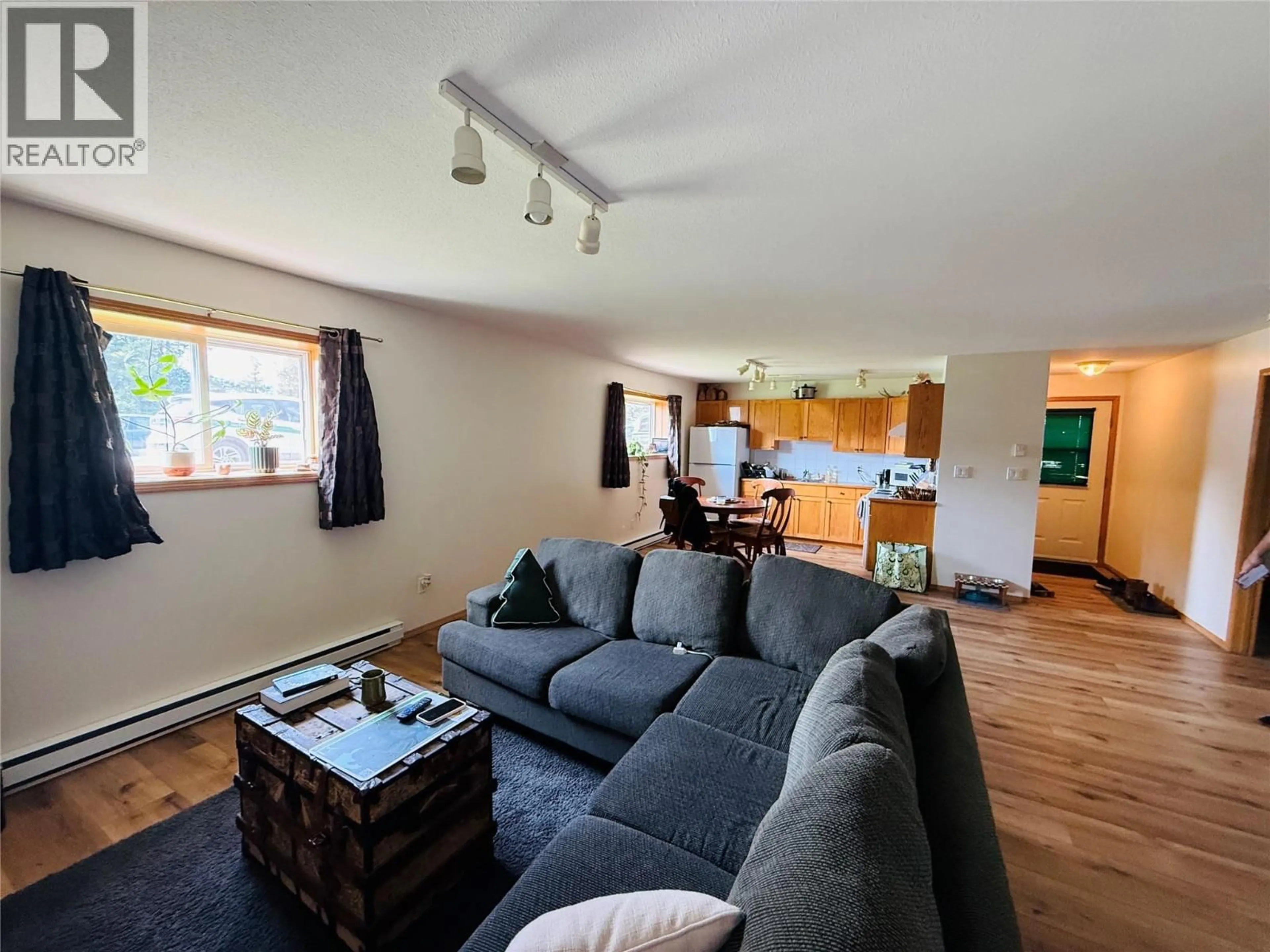 Living room with furniture, wood/laminate floor for 7506 COLUMBIA AVENUE, Radium Hot Springs British Columbia V0A1M0