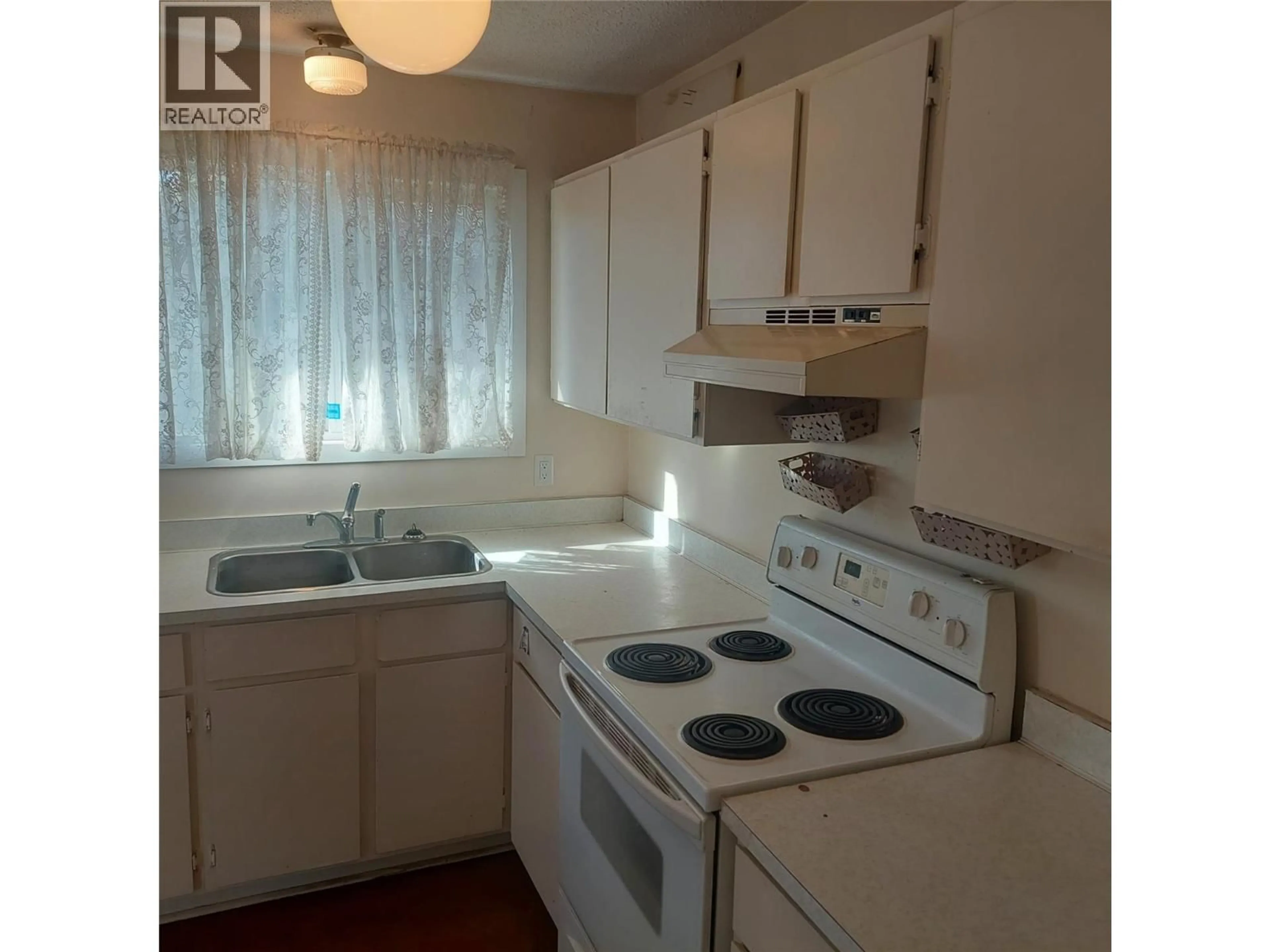 Standard kitchen, wood/laminate floor for 4403 15TH AVENUE, Vernon British Columbia V1T6Y1