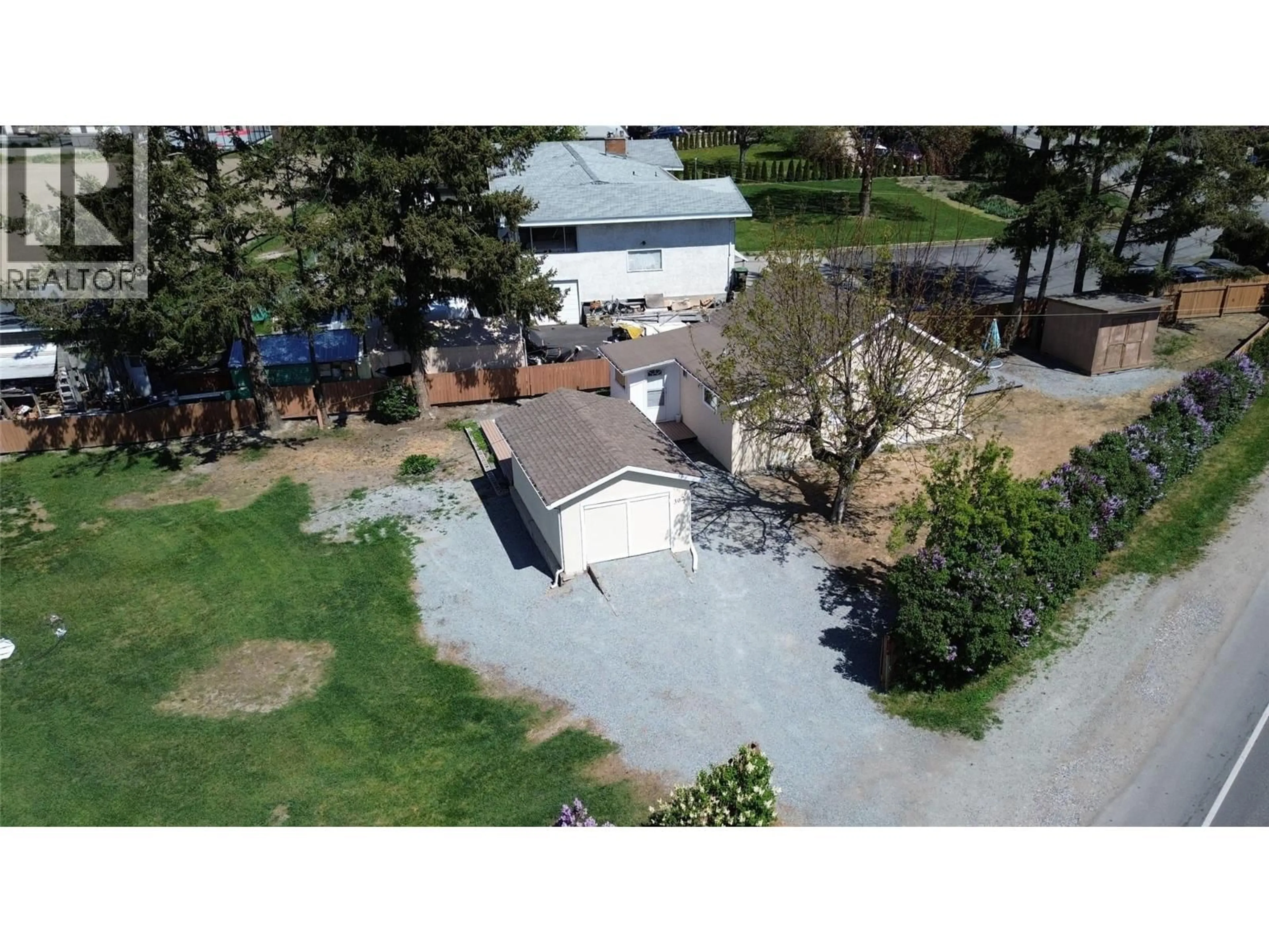 A pic from outside/outdoor area/front of a property/back of a property/a pic from drone, street for 302 VALLEY ROAD NORTH, Kelowna British Columbia V1V2G1
