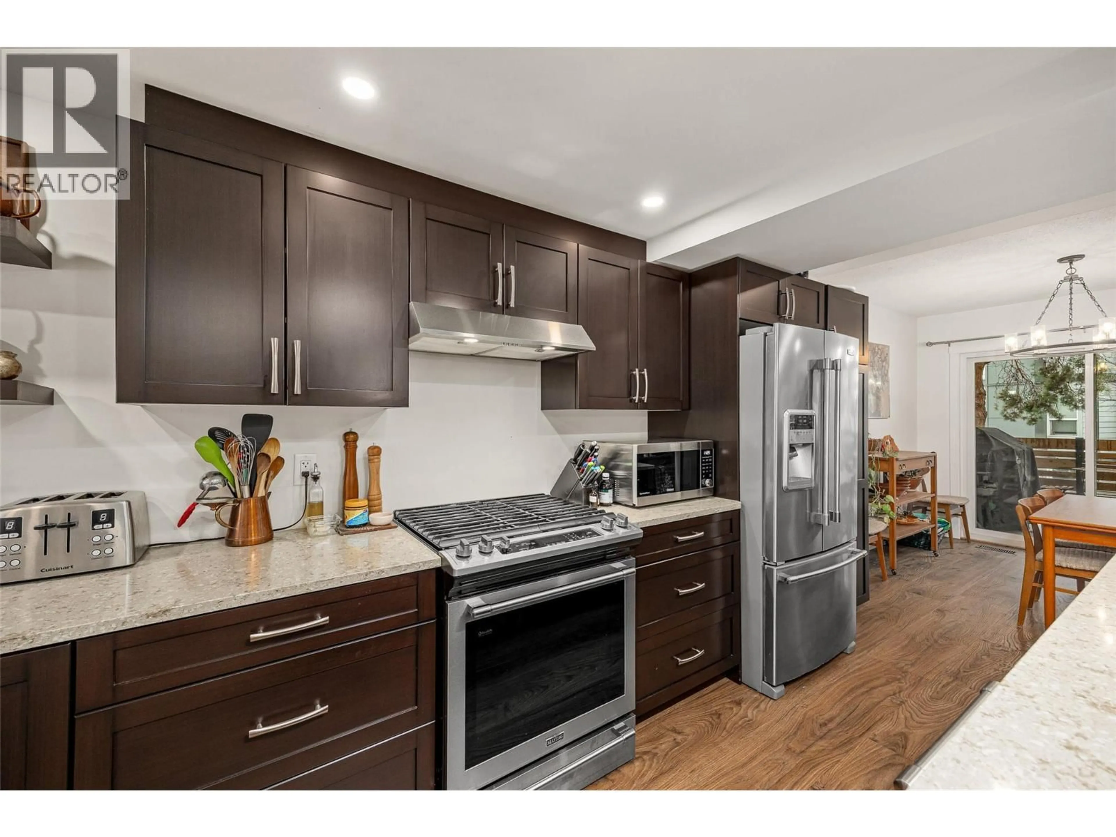 Open concept kitchen, wood/laminate floor for 210 - 2125 BURTCH ROAD, Kelowna British Columbia V1Y8N1