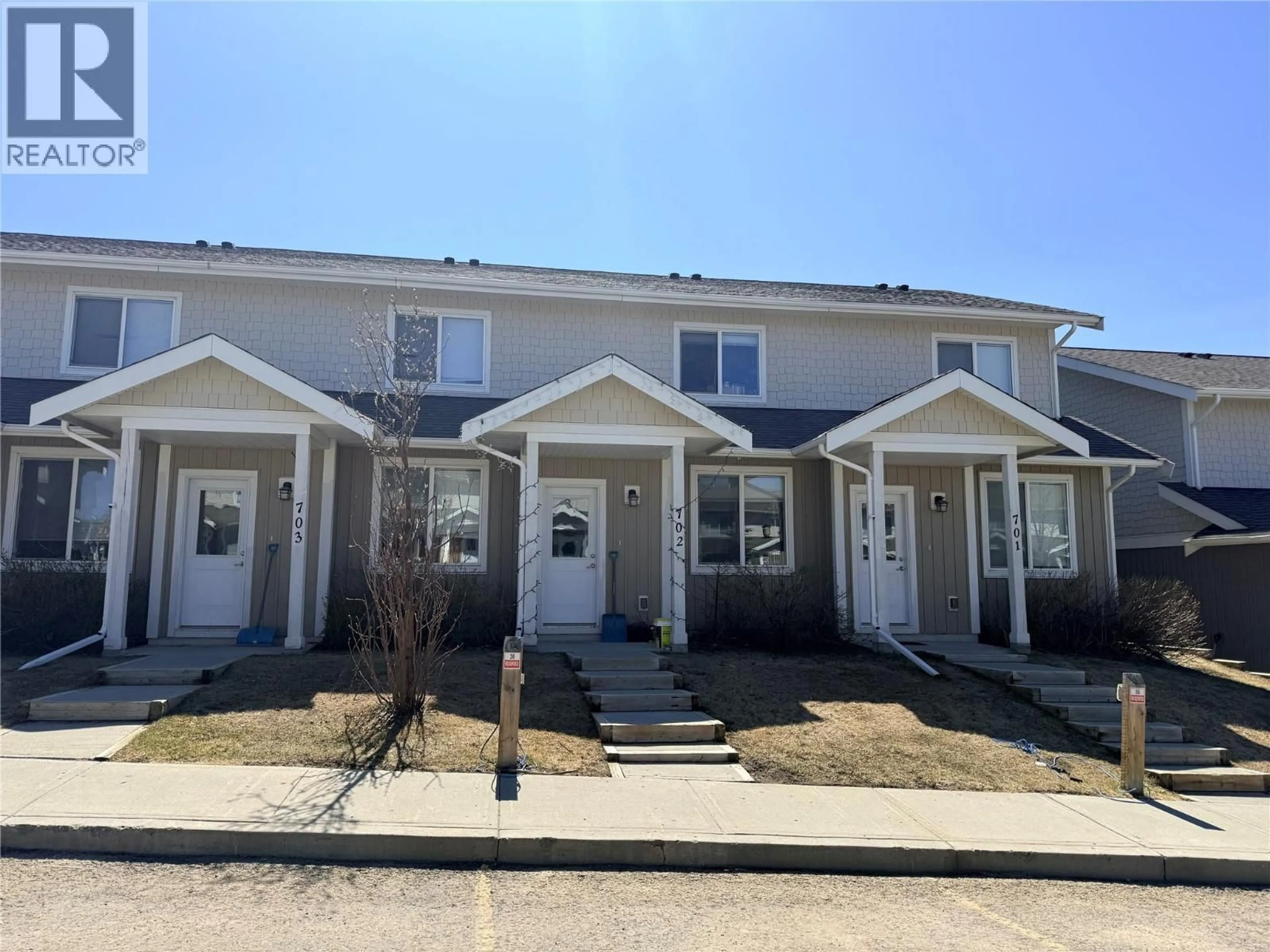 A pic from outside/outdoor area/front of a property/back of a property/a pic from drone, street for 702 - 1617 88 AVENUE, Dawson Creek British Columbia V1G0E8