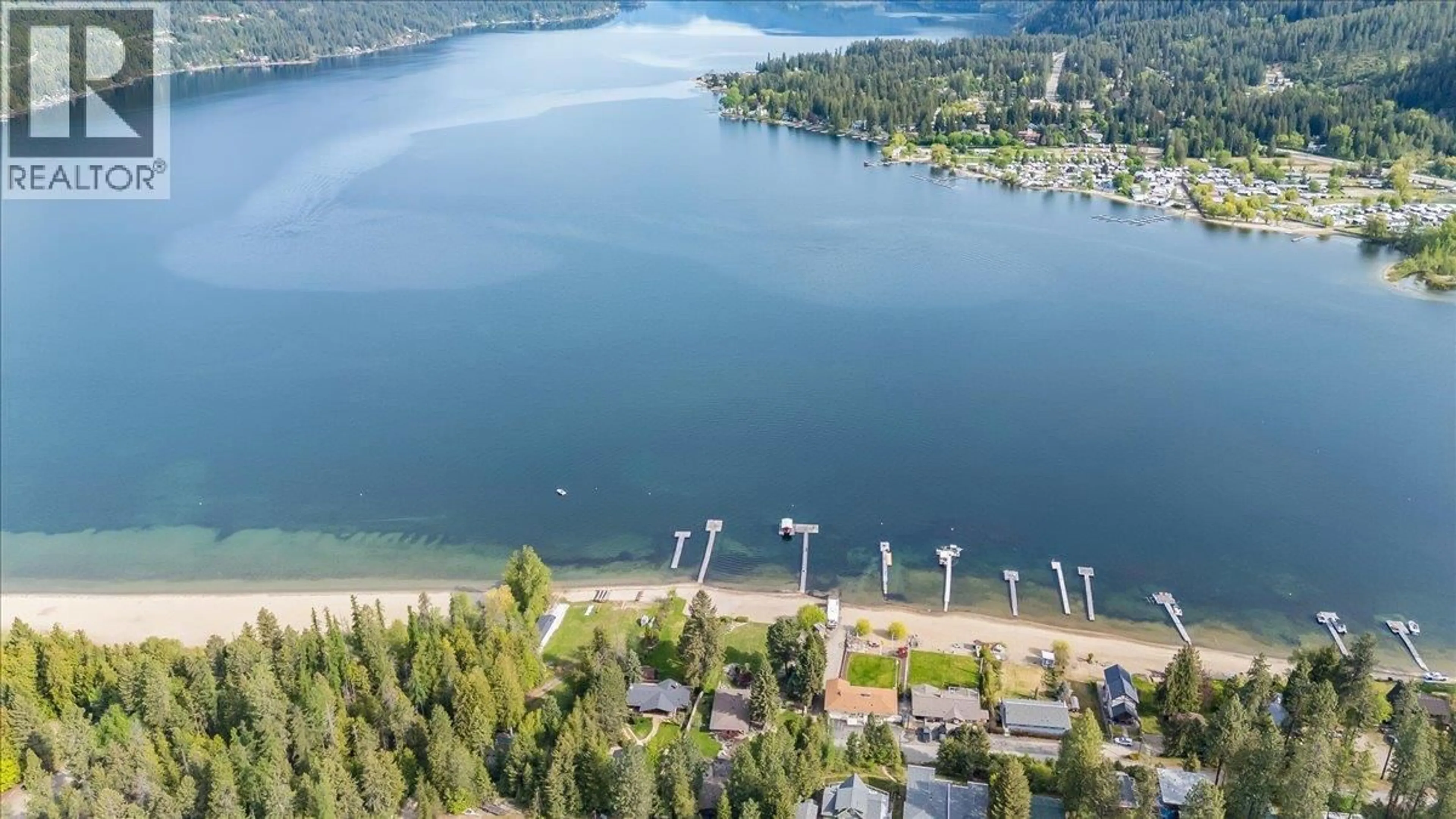 A pic from outside/outdoor area/front of a property/back of a property/a pic from drone, water/lake/river/ocean view for 100 SANDNER ROAD, Christina Lake British Columbia V0H1E0