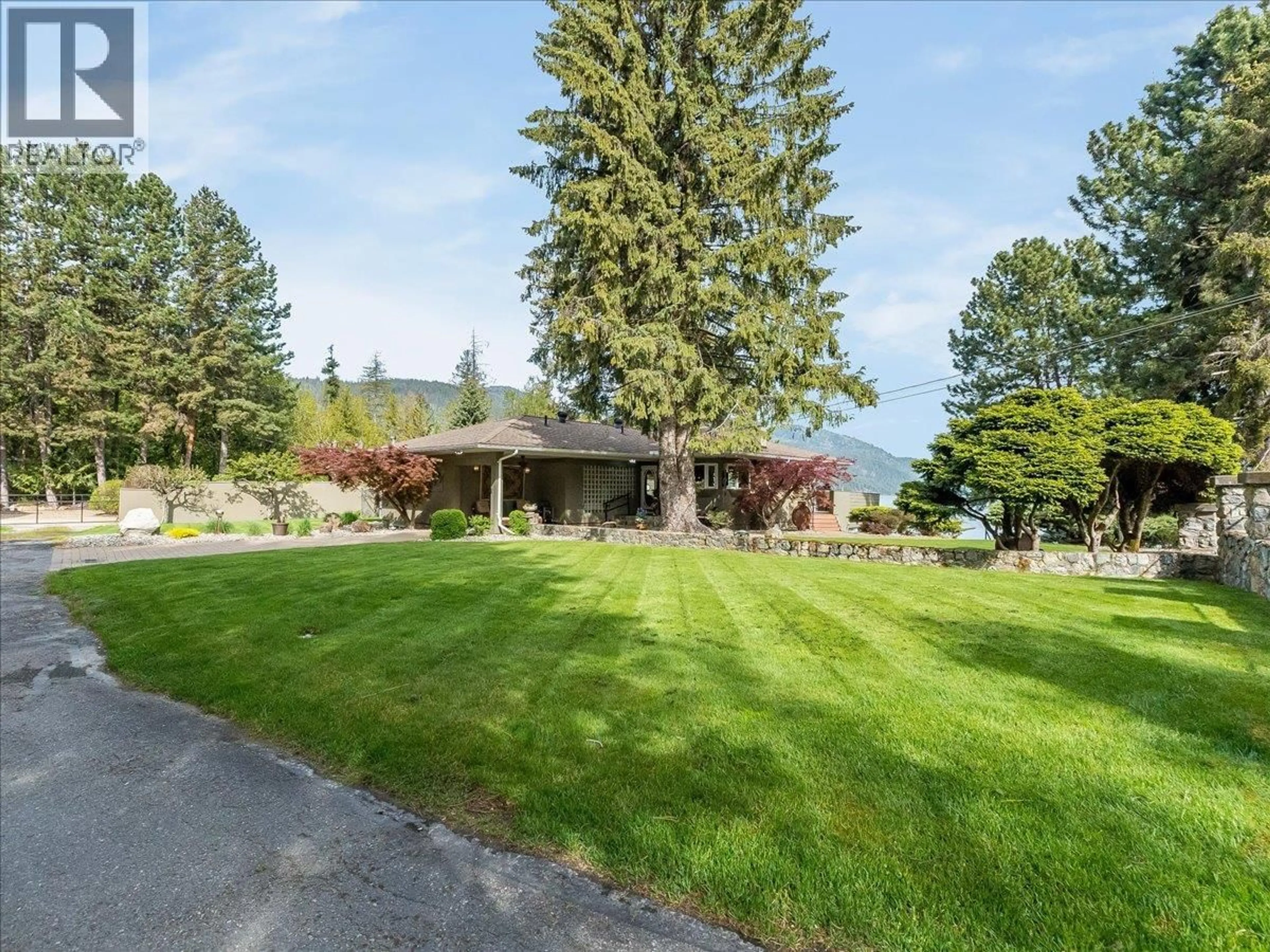 A pic from outside/outdoor area/front of a property/back of a property/a pic from drone, water/lake/river/ocean view for 100 SANDNER ROAD, Christina Lake British Columbia V0H1E0