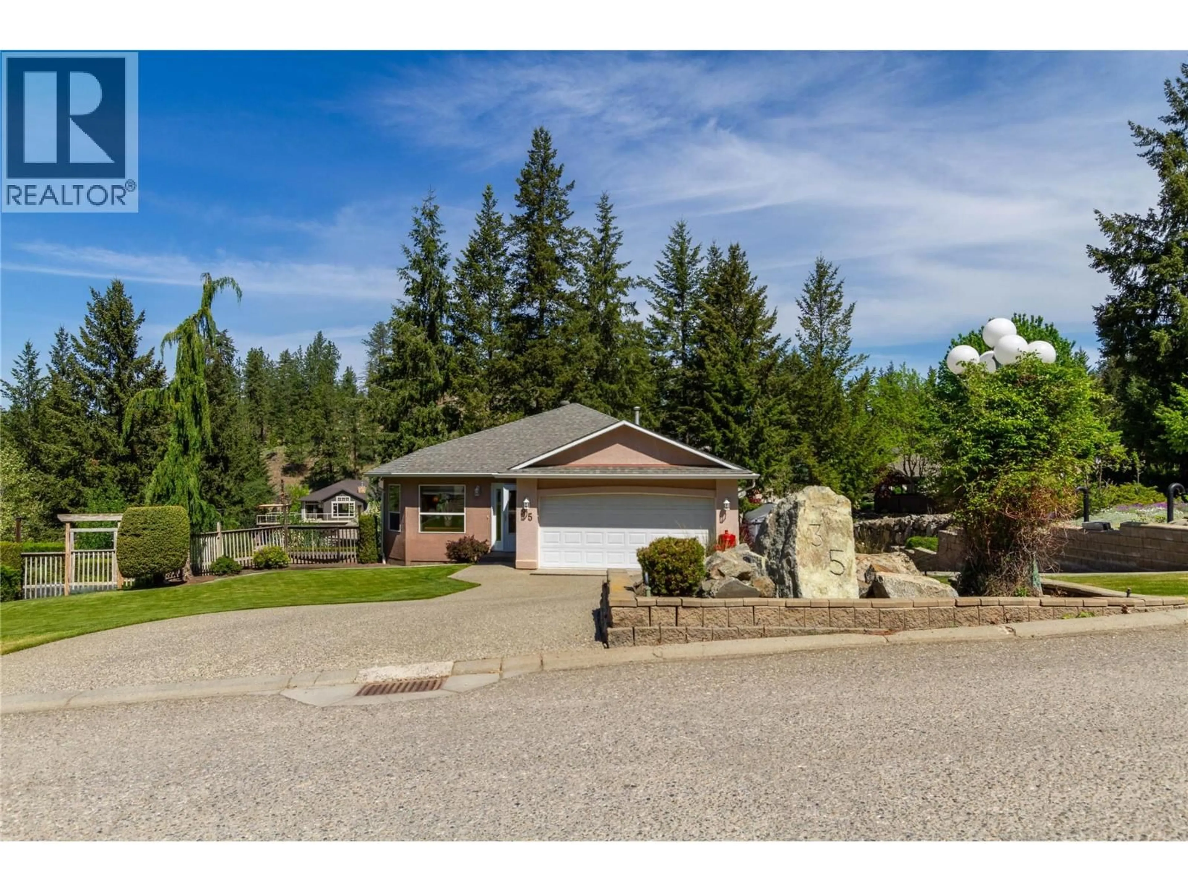 A pic from outside/outdoor area/front of a property/back of a property/a pic from drone, unknown for 35 PEREGRINE WAY, Vernon British Columbia V1H1E4