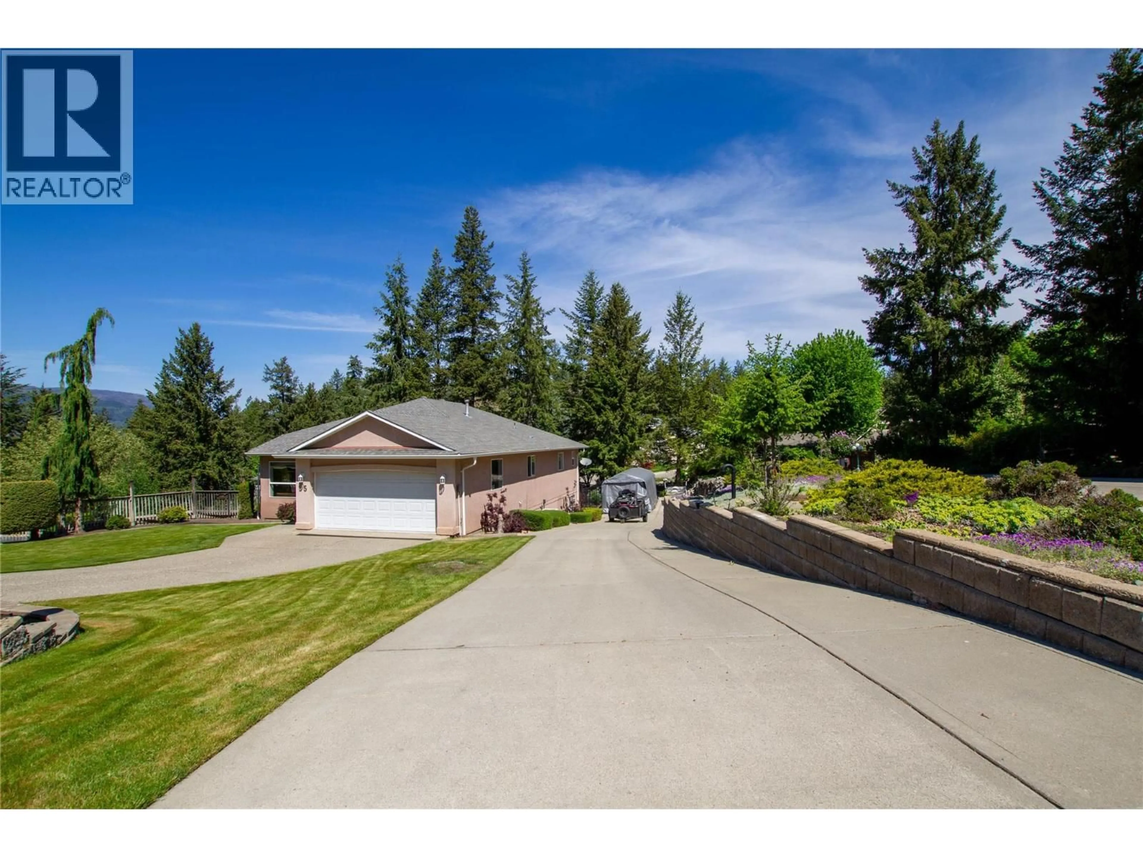 A pic from outside/outdoor area/front of a property/back of a property/a pic from drone, unknown for 35 PEREGRINE WAY, Vernon British Columbia V1H1E4